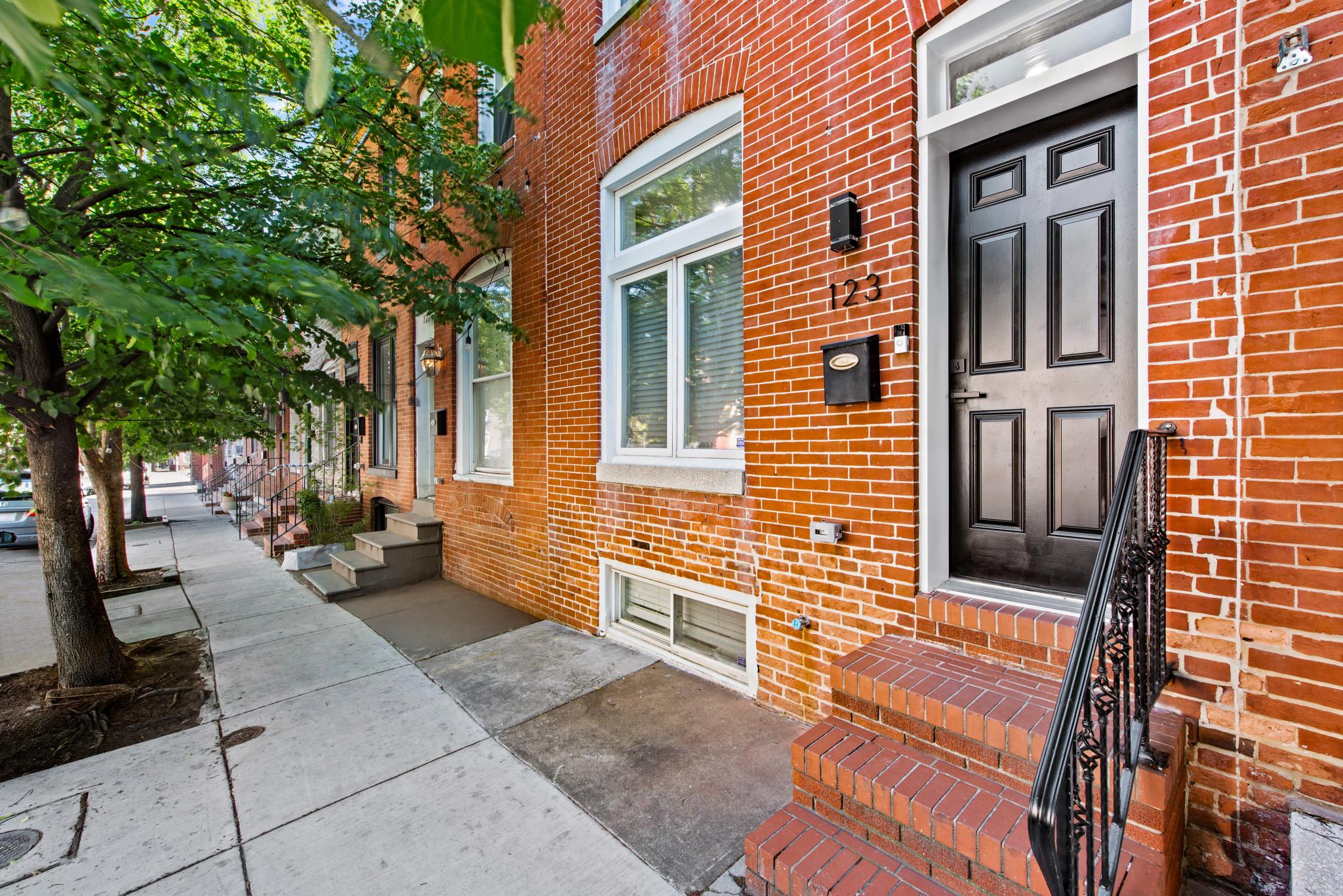 Beautifully renovated Federal-style rowhome in the heart of Highlandtown offering approximately 1,700 square feet of finished living space with 3 bedrooms and 3 full bathrooms. The brand-new kitchen features gorgeous modern two color cabinetry, sleek Carrara White quartz countertops, and new appliances, all covered by a 5-year Lowe’s home warranty for added peace of mind.

Upstairs, you’ll find two spacious, light-filled bedrooms, including a primary suite with a private en suite bathroom featuring a soaking Jacuzzi tub and separate shower. A second full bathroom and convenient bedroom-level Samsung laundry complete the upper level.

The finished lower level offers brand-new plush carpeting, a large family room with plenty of space for a large sectional and wall-mounted TV, an additional bedroom or office, and a third full bathroom. A new water heater has also just been installed.

This home blends classic Federal-style charm with modern industrial touches, including striking floating staircases with iron railings. Ideally located just minutes from Johns Hopkins Hospital with easy access to I-95 and I-895, this move-in-ready home offers stylish updates and convenience throughout. Don’t miss this opportunity!