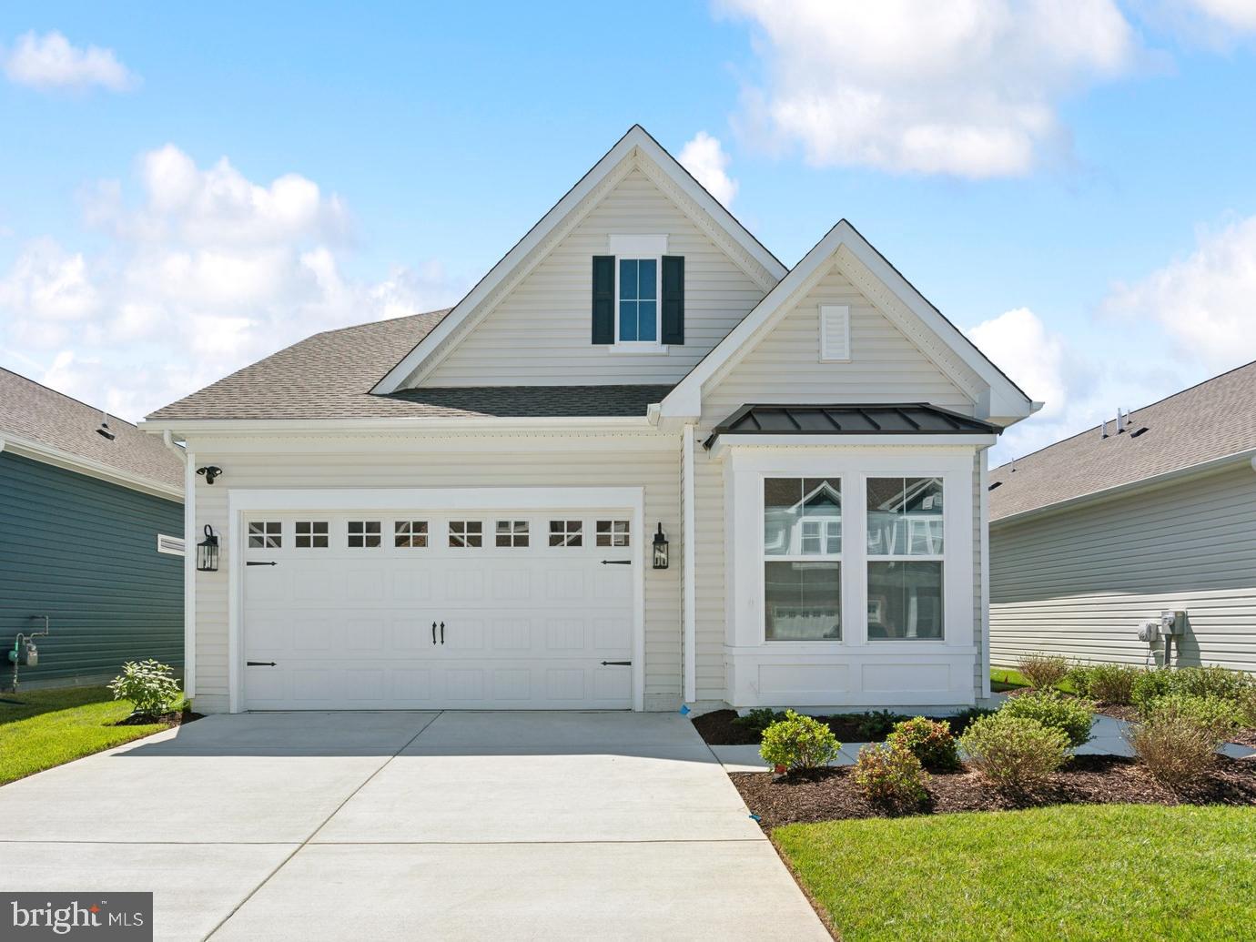 Welcome to the Simone, a beautifully designed home offering 4 bedrooms, 3 baths, and a 2-car garage. This home combines thoughtful design with comfortable living spaces ideal for both everyday life and entertaining. The main living area features a cozy one-story fireplace, creating a warm and inviting focal point. 

A dedicated home office provides a private space for work or study, while the screened patio extends your living area outdoors—perfect for relaxing or hosting guests. The kitchen is designed for both style and function, featuring a single oven, microwave, gas cooktop with range hood, dishwasher, French door refrigerator, pendant lighting, tile backsplash, and quartz countertops. Quartz is also featured in the owner’s bath for a cohesive and elegant finish. 

Luxury vinyl plank flooring runs throughout the foyer, extended foyer, kitchen, dining area, great room, bedroom 2, owner’s suite, HovHall, loft/second floor, and bedrooms 3 and 4. Tile flooring is featured in all full baths and the laundry room. The owner’s bath includes a walk-in shower with a seat and handheld shower wand, along with a double-sink vanity for added comfort and convenience. 

For a full list of features for this home please contact our sales representatives. 
Photos are for illustrative purposes only and may not represent the exact home or finishes available. 

Welcome to a new luxury active adult 55+ community on Maryland's Chesapeake Bay. Discover the amenity-filled, resort-style experience within 45 miles of Washington DC and Baltimore. Residents can take advantage of the community's 24,000 sq. ft. clubhouse with indoor & outdoor pools, a state-of-the-art fitness center, and multiple tennis and pickleball courts. With a full-time lifestyle director on site the community also features a well-maintained calendar of activities such as walking club, indoor and outdoor yoga sessions, mahjong club, kayaking, pickleball and more. Kent Island life is about making friends and enjoying the company of people who have worked hard and now want to enjoy all that a luxury 55+ community has to offer. Located steps from the water and minutes from Annapolis, the location also offers quick access to Rt. 50. Enjoy the convenience of nearby dining and shopping options together with the quaint charm of a small town.