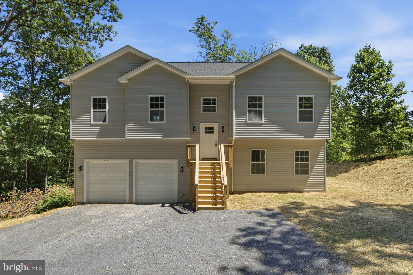 Brand new split foyer home located in Shawnee Land subdivision, situated on a beautiful 0.34-acre wooded lot with mature trees.  This home offers both privacy and accessibility. The thoughtfully designed floor plan features 3 bedrooms and 3 full bathrooms, including a spacious primary bedroom with a private bath and walk-in closet. Enjoy a bright kitchen with an island bar, stainless steel appliance package, Quartz countertops, perfect for everyday living and entertaining, along with spacious dining area and Livingroom, a large family room that provides plenty of space to relax. The home also includes a two-car garage.