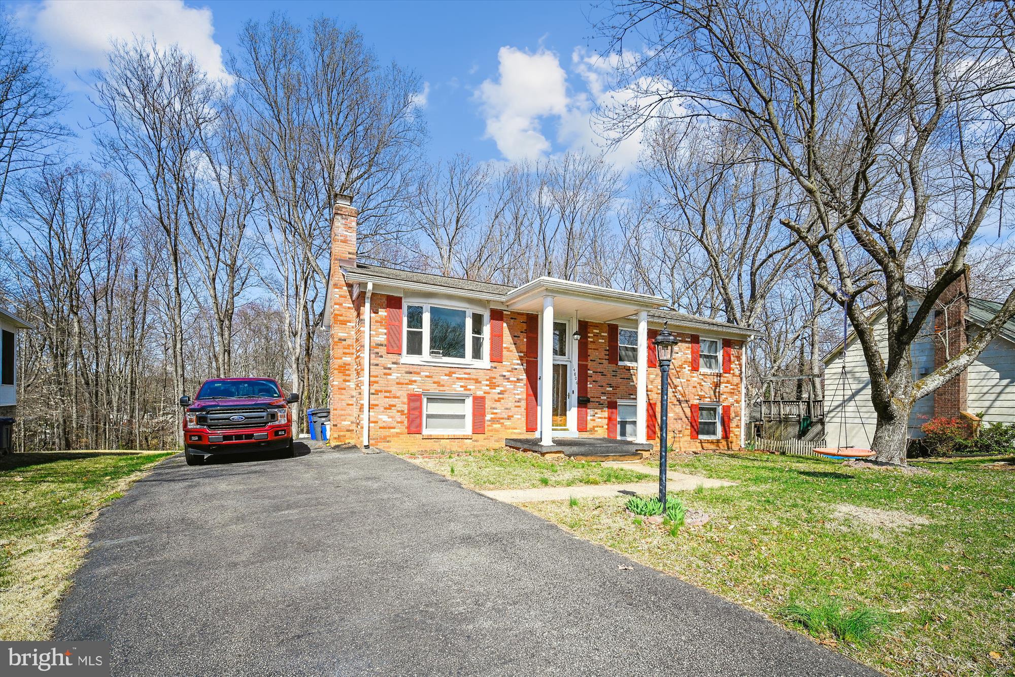 WELCOME HOME!!! MOVE IN READY BRICK FRONT SINGLE FAMILY SPLIT LEVEL HOME - 4 SPACIOUS BEDROOMS - 3 BATHROOMS - STAINLESS STEEL APPLIANCES-  NEW COMPOSITE WOOD FLOORING UPSTAIRS  - NEW PRIMARY BATHROOM REMODEL-BRICK WOODBURNING FIREPLACE IN BASEMENT- 300 SQFT COMPOSITE 2ND STORY DECK- 400 SQFT PATIO WITH FIREPIT-OUTDOOR GRAVEL KITCHEN AREA WITH OVERHEAD AWNING-LARGE DECK-GREAT BACKYARD- 2 SHEDS-LARGE DRIVEWAY-ROOF WAS REPLACED IN 2022- BOTH SLIDING DOORS REPLACED IN 2023-EXCELLENT LOCATION-CLOSE TO SCHOOLS, SHOPPING, RESTAURANTS, PARKS, MAJOR HIGHWAYS, COMMUTER OPTIONS INCLUDING VRE AND MORE!!