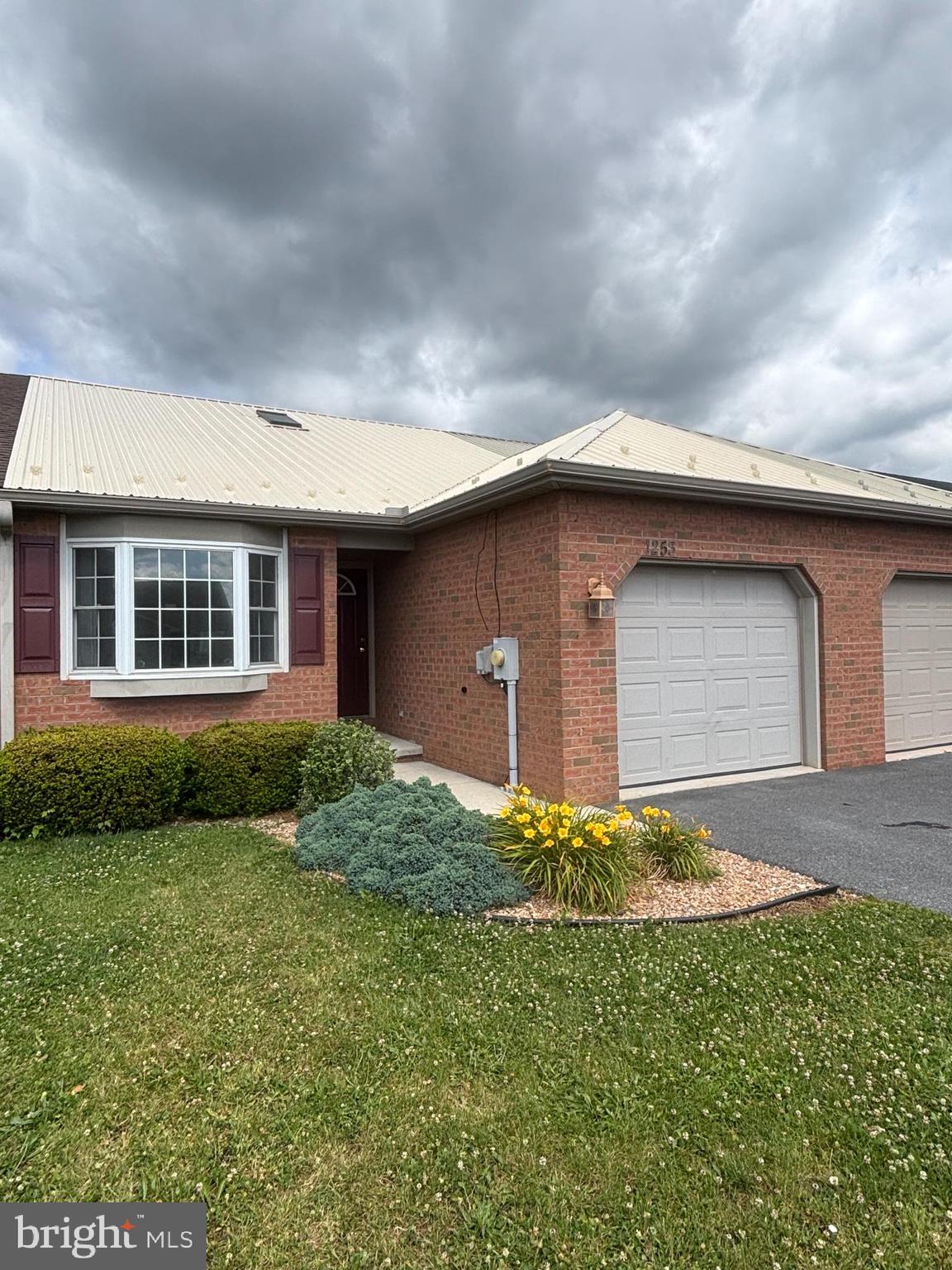 ONE LEVEL LIVING
Don't miss this well-maintained brick ranch style townhome. Heat pump replaced in May 2024, roof in 2021, hot water heater in 2019. Open floor plan living/kitchen/dining, two bedrooms, two full bathrooms, covered rear porch with built-in shed, mature landscaping, large rear yard and one car attached garage.