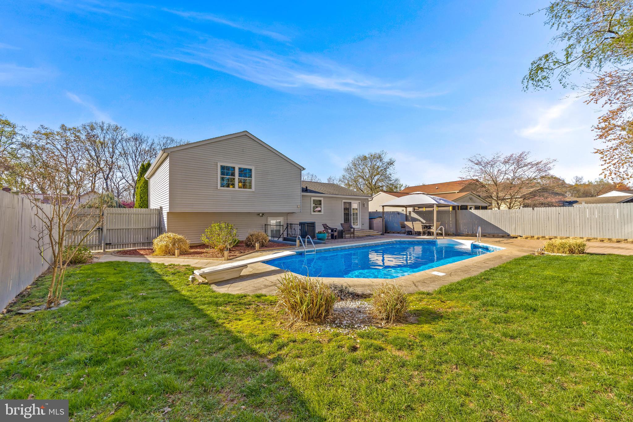 Step into this custom updated single-family home that truly checks all the boxes! Located in a warm, family-friendly neighborhood, this home is as inviting as it is functional—perfect for those who love to entertain and enjoy life to the fullest. The heart of the home features an updated kitchen with modern finishes, a marble backsplash, stainless steel appliances, and plenty of counter space, ideal for home-cooked meals or hosting lively gatherings. Just beyond, step out into a stunning backyard oasis—complete with an in-ground pool, lush landscaping, and ample patio space for summer BBQs or evening hangouts under the stars. Downstairs, the second living room feeds into another level featuring a finished basement that's a game day haven, featuring a custom bar area perfect for hosting friends and family. The list of updates this home features is massive including updated windows with a transferable lifetime warranty (2018), pool pump/filter/cover/liner (2020-2024), full bathroom on lower level (2021), Mohawk flooring on master bedroom level (2021), Roof is only 12 years old and so much more! Reach out to the listing agent for an itemized breakdown of custom finishes/updates and schedule your showing today! This stunning home won't be on the market for long.