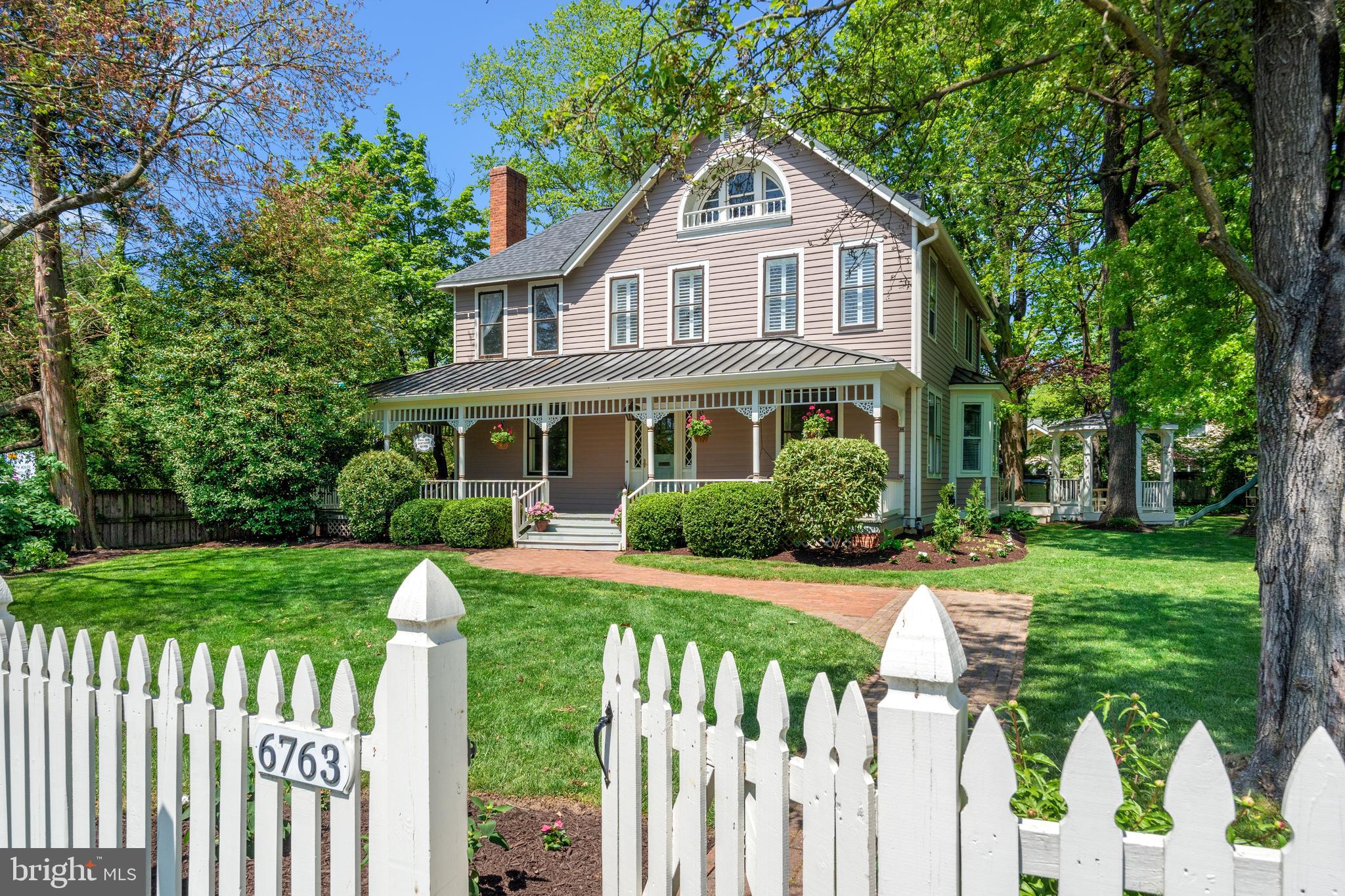 *****Assumable VA Loan, balance of $860,000, Interest rate of 3.87%*****

Welcome to this exquisite 5-bedroom, 4-bathroom Victorian farmhouse in the heart of North Arlington — a home with timeless character and modern updates in a commuter's dream location. Situated on a rare 1/3-acre lot, this beautifully maintained home offers over 3,900+ square feet of thoughtfully designed living space, a detached 2-car garage, and exceptional outdoor entertaining areas.

From the moment you arrive, the covered wrap-around front porch invites you in. Inside, you'll find soaring 9ft+ ceilings on the main level, a formal living room with a wood-burning fireplace, and a banquet-sized dining room featuring a fir beaded ceiling and bay window — perfect for hosting gatherings. A full bedroom/office and bathroom on the main level add flexibility for working from home or guests.

The newly renovated kitchen combines style and function, featuring Quartz countertops, stainless steel appliances, and a breakfast bar. It opens seamlessly into the family room, where floor-to-ceiling glass doors lead to your private backyard retreat. A convenient laundry room/mudroom completes the main level.

Upstairs, the spacious primary suite includes two walk-in closets and a luxurious renovated bath. Three additional bedrooms share a stylish hall bath. The sunny and expansive third level offers a versatile recreation room, guest bedroom, and another full bath — ideal for extended family, guests, or a second home office.

Outside, enjoy a large rear deck, charming gazebo, and oversized patio — perfect for summer entertaining. The detached 2-car garage includes an attached garden shed, and the expansive yard provides ample space for gardening, play, or future expansion — a rare find in North Arlington.

Don’t miss the opportunity to own a spacious, character-filled home in one of Arlington’s most sought-after neighborhoods.

Recent enhancements —  ✔️ New roof and gutters 2023 ✔️ Quartz counters 2025 ✔️Carpet 2023 ✔️ A/C unit 2023 ✔️ EV charging station — ensures turnkey ease and modern functionality ✔️ GE dishwasher 2024 ✔️ Bosch refrigerator 2020  ✔️ Updated en-suite bath 2020 ✔️ Renovated hall bath 2018 

Ideally located just 1/2 mile from the East Falls Church Metro, 10 miles to Reagan National Airport (DCA), and 18 miles to Dulles International Airport, this gracious Victorian farmhouse offers a rare blend of timeless charm and modern comfort. Nestled in one of North Arlington’s most desirable neighborhoods, the home is within walking distance to top-rated schools, beautiful parks, and local favorites in Westover and Falls Church — including the beloved Italian Store, Northside Social, the brand-new Whole Foods Market, and more!