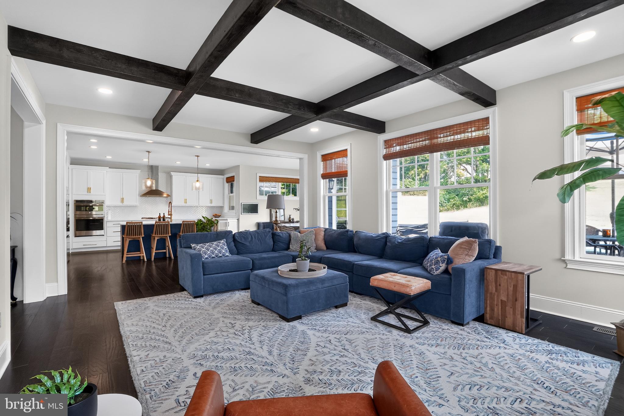 Crafted by the highly respected Thompson Builders in 2022, this exceptional four-bedroom residence at 223 Daylesford Court showcases sophisticated design, premium craftsmanship and an impressive collection of custom upgrades in one of Kennett Square's most desirable communities.

Perfectly positioned on a coveted corner lot, the home offers timeless curb appeal with a durable Hardie Plank exterior and an expanded deck designed for effortless outdoor entertaining. Inside, refined finishes create an elegant yet welcoming atmosphere, including 9-foot ceilings throughout, rich hardwood flooring across the entire main level, impressive 10-inch baseboard molding, custom designer lighting and striking architectural beams that define the stunning great room.

At the heart of the home, the gourmet kitchen features quartz countertops, abundant cabinetry and an open-concept design that flows seamlessly into the dining and living spaces making it ideal for both everyday living and elegant entertaining. Just off the main living area, a cozy first-floor study provides the perfect retreat for working from home, reading or enjoying a quiet space away from the main gathering areas.
Every detail has been thoughtfully considered, from the recently completed custom built-in entryway storage to the beautifully finished laundry room featuring bespoke cabinetry that combines style with everyday functionality.

Upstairs, the spacious primary suite serves as a private sanctuary, complete with a luxurious ensuite bath featuring dual vanities and two spacious walk-in closets with custom built-in organization systems, offering exceptional storage, style, and everyday convenience. Three additional generously sized bedrooms provide ample space for family, guests or additional flex space.

The professionally finished lower level offers an extraordinary extension of the home's living space with luxury LVP flooring, a sophisticated dry bar with quartz countertops, a stylish powder room and versatile areas perfectly suited for a home office, fitness studio, media lounge or recreation room.

Adding to its exceptional appeal, scenic walking and biking trails are accessible just across Walnut Road, providing a picturesque connection to the heart of historic Kennett Square, where award-winning restaurants, charming boutiques, cafés and year-round community events await.

Combining impeccable craftsmanship, designer finishes, thoughtful upgrades and an unbeatable location, this is a rare opportunity to own a nearly new luxury home where every detail has been carefully curated for elevated everyday living.

*Zestimate is grossly inaccurate. See recent neighborhood sales.*