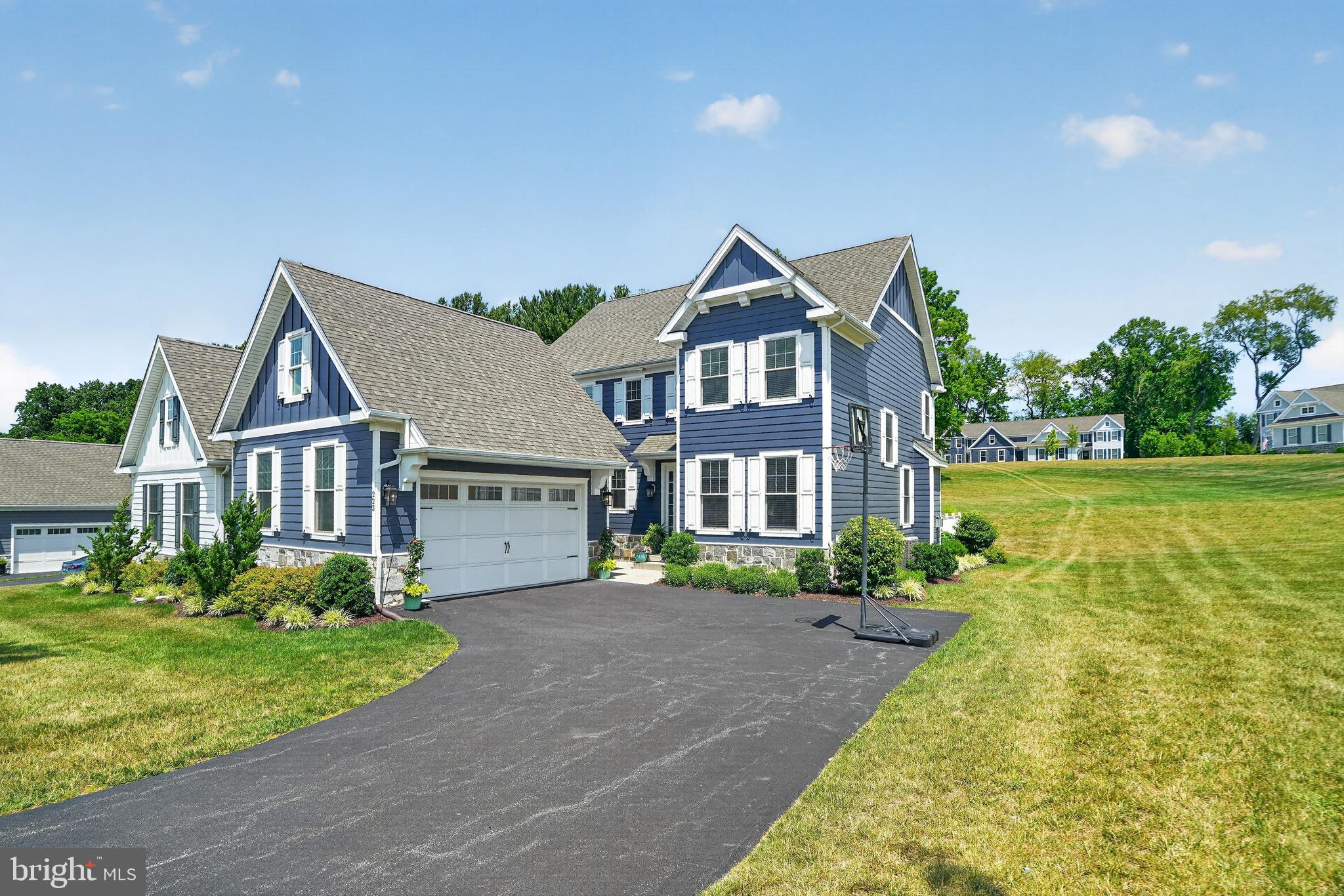 Crafted by the highly respected Thompson Builders in 2022, this exceptional four-bedroom residence at 223 Daylesford Court showcases sophisticated design, premium craftsmanship and an impressive collection of custom upgrades in one of Kennett Square's most desirable communities.

Perfectly positioned on a coveted corner lot, the home offers timeless curb appeal with a durable Hardie Plank exterior and an expanded deck designed for effortless outdoor entertaining. Inside, refined finishes create an elegant yet welcoming atmosphere, including 9-foot ceilings throughout, rich hardwood flooring across the entire main level, impressive 10-inch baseboard molding, custom designer lighting and striking architectural beams that define the stunning great room.

At the heart of the home, the gourmet kitchen features quartz countertops, abundant cabinetry and an open-concept design that flows seamlessly into the dining and living spaces making it ideal for both everyday living and elegant entertaining. Just off the main living area, a cozy first-floor study provides the perfect retreat for working from home, reading or enjoying a quiet space away from the main gathering areas.
Every detail has been thoughtfully considered, from the recently completed custom built-in entryway storage to the beautifully finished laundry room featuring bespoke cabinetry that combines style with everyday functionality.

Upstairs, the spacious primary suite serves as a private sanctuary, complete with a luxurious ensuite bath featuring dual vanities and two spacious walk-in closets with custom built-in organization systems, offering exceptional storage, style, and everyday convenience. Three additional generously sized bedrooms provide ample space for family, guests or additional flex space.

The professionally finished lower level offers an extraordinary extension of the home's living space with luxury LVP flooring, a sophisticated dry bar with quartz countertops, a stylish powder room and versatile areas perfectly suited for a home office, fitness studio, media lounge or recreation room.

Adding to its exceptional appeal, scenic walking and biking trails are accessible just across Walnut Road, providing a picturesque connection to the heart of historic Kennett Square, where award-winning restaurants, charming boutiques, cafés and year-round community events await.

Combining impeccable craftsmanship, designer finishes, thoughtful upgrades and an unbeatable location, this is a rare opportunity to own a nearly new luxury home where every detail has been carefully curated for elevated everyday living.

*Zestimate is grossly inaccurate. See recent neighborhood sales.*