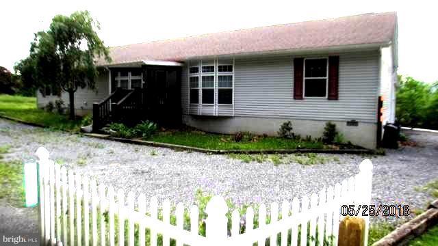 Enjoy the mountain views from the back porch or from family room with fireplace. This nice home has living room, dinning room and breakfast room,  2 baths, 3 bedrooms, plus separate laundry room.  Work in garage with separate 100 amp breaker box.  Several different mortgage financing options available. Convenient location with public park, pool, Natural Forest, with fishing, hiking nearby.