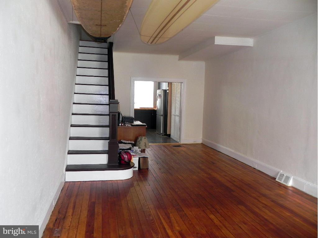Charming starter home 1/2 a block from Patterson Park.  2 BR 1.5 baths, original hardwood floors and staircase, updated bath w/claw foot tub, recently updated kitchen, fresh neutral paint throughout, floors were just re-finished, and new carpet in bedrooms.  Unfinished basement great for storage or workspace, roof recently re- coated, 1 car garage.