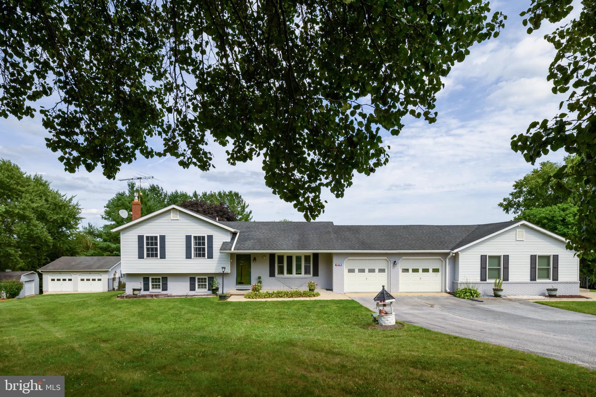 Aging Parents? College kids who need their own space? Check out his stunning multi-generational home offering over 3,700 square feet of living space on 1.5+ private acres with no HOA. This beautifully maintained 4-bedroom, 3.5-bath split-level home combines modern updates, flexible living arrangements, and outstanding indoor and outdoor living spaces in a desirable area.

The main residence features 3 bedrooms, 2.5 baths, and new LVP flooring throughout. The centerpiece of the home is the fully remodeled gourmet kitchen, showcasing soft-close white shaker cabinetry, Calacatta Ultra Quartz countertops, stainless steel appliances,  wide-wood look plank porcelain tile flooring tile and a stunning 7-foot double waterfall island perfect for entertaining and everyday living. Andersen windows throughout provide abundant natural light, while updated lighting and fresh finishes create a bright and inviting atmosphere.

A private in-law suite offers exceptional flexibility and includes its own entrance, full kitchen, living room, spacious bedroom with a large walk-in closet, full bath, private deck overlooking the backyard, dedicated washer and dryer, and an unfinished lower level providing ample storage or future expansion opportunities.

Outdoor amenities include an oversized deck with custom lighting, paver patio, fenced backyard, mature landscaping, and scenic views across the property. Both decks were thoughtfully designed and built to accommodate the future addition of a four-season room or a screened-in porch, offering excellent potential to expand your living space while enjoying the surrounding views.. The attached 2-car garage conveniently connects both living spaces, while the detached 2-car garage with electric service provides additional room for vehicles, hobbies, workshop space, or storage. A separate storage shed is also included.

Recent improvements include water tank (2026), luxury vinyl plank flooring (2026), French drain in the in-law suite basement (2025), complete kitchen renovation (2024), stainless steel appliances (2024), Some replacement Andersen windows (2024), water softener (2023), HVAC system (2022), well pump (2021), water heater (2020), privacy fence (2020), deck and patio improvements (2019), and roof sections and gutters (2018). The home is also wired for a generator for added peace of mind.

Ideally located just minutes from Westminster, Mount Airy, shopping, dining, schools, and major commuter routes, this unique property offers the perfect blend of privacy, functionality, and modern convenience.