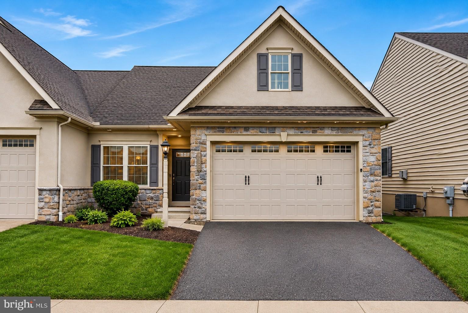 Meticulously maintained home featuring easy one-floor living and a beautifully finished walk-out lower level! The main level features 9-foot ceilings, luxury vinyl flooring, and a bright open floor plan ideal for both relaxing and entertaining. The spacious living room showcases a cathedral ceiling and provides access to the composite rear deck overlooking the backyard. The large primary suite includes a tray ceiling, walk-in closet, and a private full bath. The well-appointed kitchen features a breakfast bar, abundant cabinetry, generous counter space, and an open layout that flows seamlessly into the living room. 
The thoughtfully finished walk-out basement adds exceptional additional living space with a large lower-level family room featuring a stone-front gas fireplace, luxury vinyl plank flooring, a full bath, 3rd bedroom, and a stylish bar area complete with granite countertops, sink, microwave, and refrigerator. Whether used for entertaining, guests, hobbies, or multi-generational living, this lower level offers incredible flexibility.
Additional features include a main-level laundry room, 2-car garage with epoxy-coated floor, sidewalks and streetlights throughout the community, and an HOA that handles lawn care and snow removal for easy, low-maintenance living. Ideally located close to shopping, dining, and everyday conveniences. Pride of ownership is evident throughout this move-in ready home!