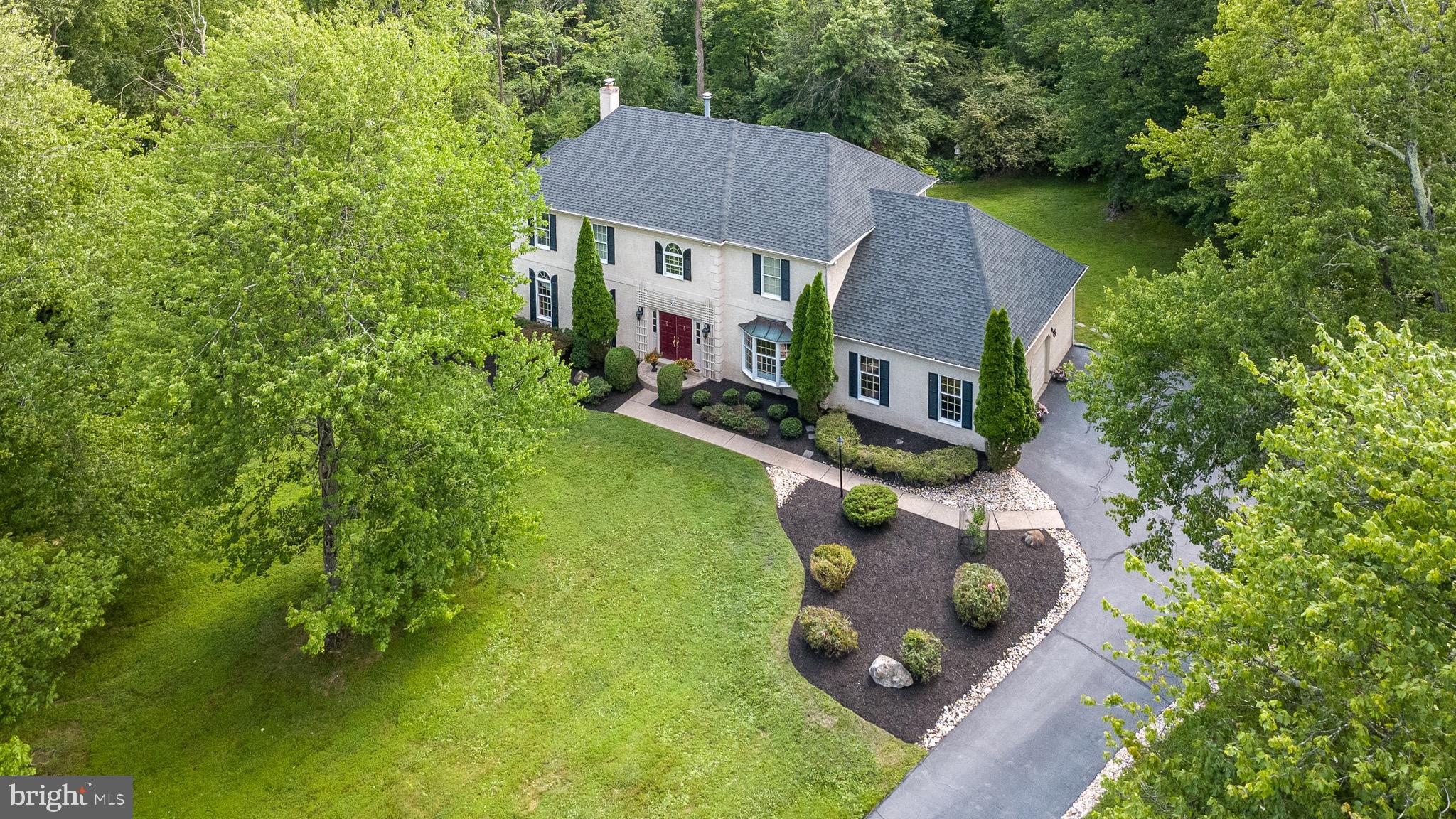 Welcome to 1620 Claudia Way, an architectural masterpiece nestled on over an acre of private, park-like grounds in Lower Gwynedd’s highly coveted Gwynedd Knoll neighborhood. Situated within the elite, award-winning Wissahickon School District, this captivating 3,476-square-foot center-hall Colonial—complemented by a 700-square-foot partially finished lower level—presents the ideal fusion of timeless charm, rich architectural craftsmanship, and versatile modern living. A striking two-story foyer commands immediate attention upon entry, boasting a grand sweeping curved staircase, classic dormer windows, lofty ceilings, custom crown moldings, and gleaming hardwood floors that extend throughout the main level. Refined, sun-drenched formal living and dining rooms offer a sophisticated setting for hosting gatherings, while a quiet main-floor executive office serves as a peaceful sanctuary for remote work or a child's playroom. At the heart of the residence lies a sun-filled gourmet kitchen equipped with a massive central island, premium finishes, and a spacious casual dining area. The kitchen transitions seamlessly into an expansive family room anchored by a cozy, brick-framed fireplace, creating an inviting hub for daily life. Sliding glass doors open directly to the stone patio, offering effortless transition to outdoor living. Uniquely adaptable, the home is currently configured with a main-floor au-pair or guest suite featuring its own full bath—ideal for multi-generational living, an additional private office, or a walk-in pantry.  The upper level is crowned by a primary sanctuary complete with a lavish ensuite bath, a generous private sitting room, and an expansive walk-in wardrobe. Two additional sun-drenched bedrooms round out the second level. Originally designed as a 4-bedroom home, the versatile floor plan can be easily transitioned back to its original 4-bedroom layout. Step outside into an incredible backyard retreat that feels straight out of the countryside: a secluded stone patio with a beautiful Koi pond. With more than one acre of tree-lined privacy, the expansive, lush green lawns are beautifully framed by professional landscaping. The property's private, park-like setting will be the backdrop for years of outdoor entertaining, with the secluded back patio designed for hosting lively gatherings, summer barbecues, or quiet evenings surrounded by vibrant, mature greenery. Conveniently located just minutes from Routes 202 and 309, shopping, and fine dining, this remarkable residence stands as an extraordinary opportunity in one of Lower Gwynedd's premier enclaves.  For buyers looking to customize a home to their exact tastes, this property is the ultimate canvas. The possibilities are endless! 

(Sellers are actively packing to move; please excuse the temporary moving materials while focusing on the phenomenal layout and magnificent setting!)
