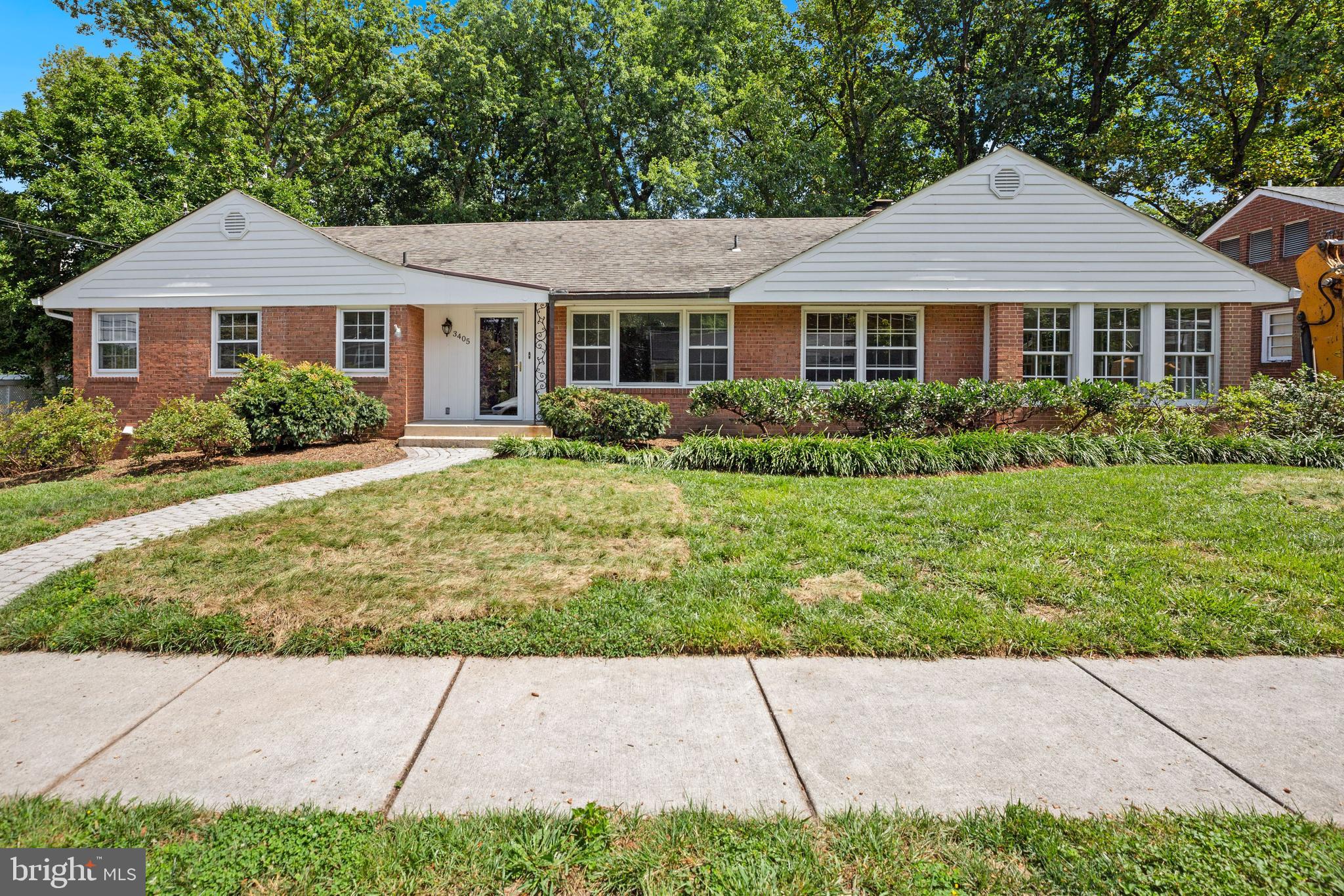 Presenting 3405 Peary Street. Enjoy updated kitchen with island, 42" custom cabinetry, and a two-story addition featuring an open and bright sunroom with vaulted ceilings and skylights. Daylight walkout basement features lower-level family room with 4th bedroom and 3rd full bath, laundry room, storage room, and bonus room. Deck with stairs down to slate patio off of sunroom. Asphalt driveway with rear loading 2 car garage. Hardwood flooring throughout with furnace, HWH & CAC replaced in 2018 as well as full floored attic storage. Short walk to Potomac River via Gulf Branch Trail and much more.