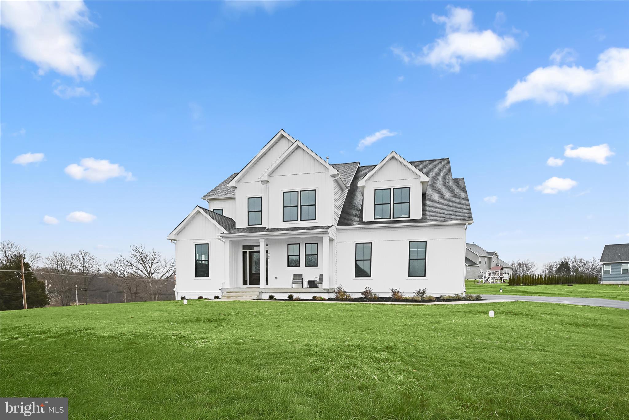 Introducing this exceptional brand new Sonoma model by Greenspring Homes in Shamrock Estates, set on a 1.46-acre corner lot. Offering four bedrooms and three and a half bathrooms, this move-in ready home showcases high-quality finishes throughout. As you arrive, the property welcomes you with a covered front porch and an oversized two-car garage. Inside, a modern neutral palette, tall ceilings, and abundant natural light create an inviting atmosphere. The two-story foyer opens to beautiful hardwood floors, with a private office behind double doors. Prepare your favorite meals in the gourmet kitchen that is fully equipped with stainless steel appliances, quartz countertops, a tile backsplash, soft-close shaker cabinetry, a center island and a convenient walk-in pantry. The dining room is ideal for entertaining and the spacious living room is perfect for relaxing. Finishing the main level is a half bathroom, a mudroom with built-in cubbies and access to the garage. Upstairs, the primary bedroom suite awaits with a walk-in closet and a luxurious bathroom featuring a dual-head walk-in shower, double vanity, linen closet, and separate water closet. A second bedroom is across the hall, with a laundry room and second full bathroom. Completing the upper level are the third and fourth bedrooms that share a connecting full bathroom. The builder is offering a finished recreation room in the lower level.  Enjoy exceptional modern living in this brand-new home designed with comfort, style, and functionality in mind.