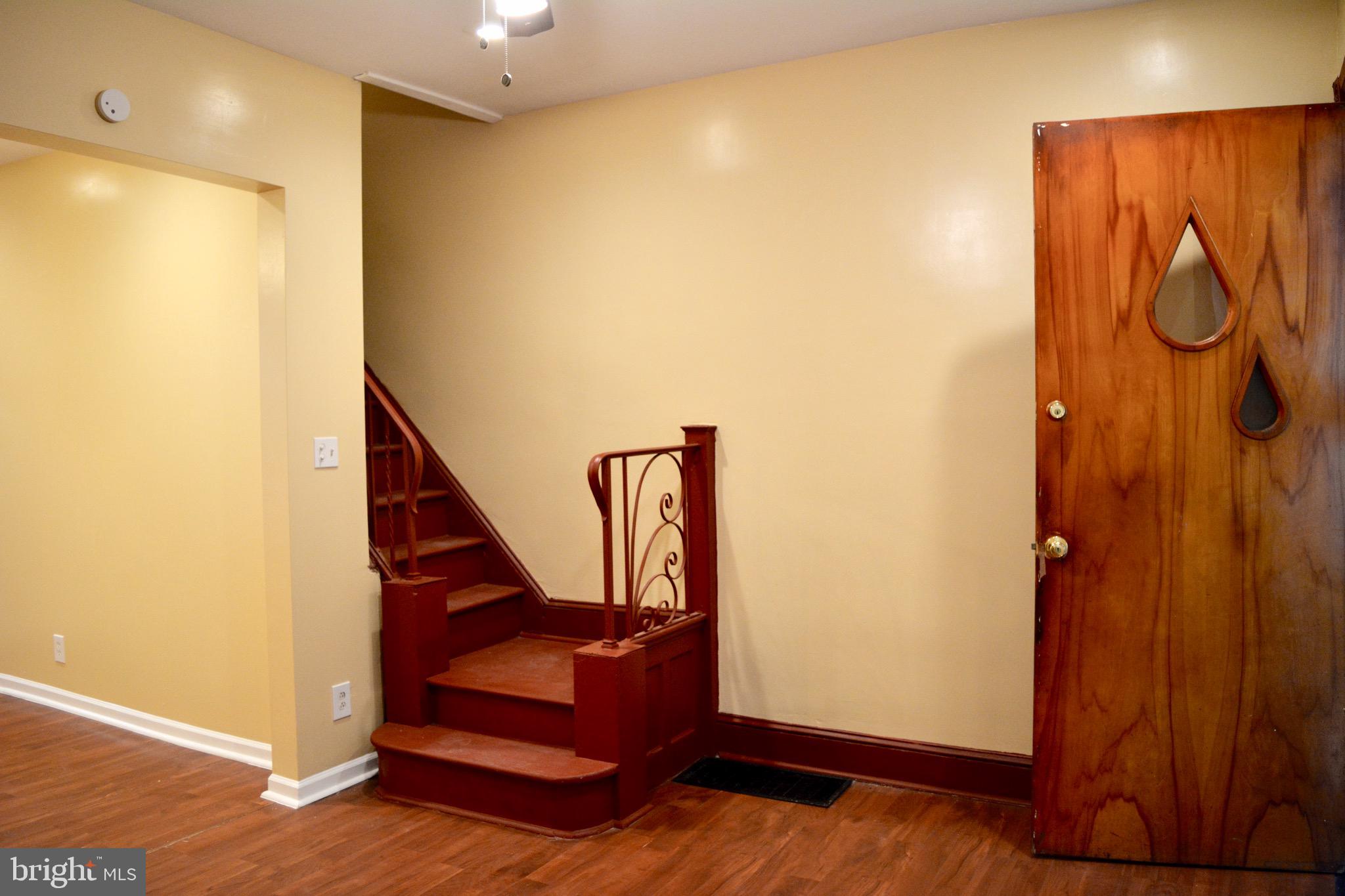 Video Walkthrough Available at https://youtu.be/4jKOGpO0rAg   .  Updated 3-4 bedroom 2 full bath  enclosed porch front row home on quiet block in Cobbs creek. Cozy clean space with enclosed front porch, living room with ornamental fireplace, separate dining room.  Kitchen with loads of cabinet & countertop space, with new stove and refrigerator.  Back storage/mud room with exit to rear enclosed yard perfect for  a sitting area and barbecue. Downstairs you have a full finished basement with tile flooring , full bath with shower, washer/dryer hookup and back bedroom/bonus room with window.  Upstairs you have three sunny bedrooms each with their own closets, and a full bath. Virtual Tour available, or come take look and submit your application. Full PAR Application with supporting docs. First Last and Security to move in. Available NOW. Video Walkthrough available at  https://youtu.be/4jKOGpO0rAg