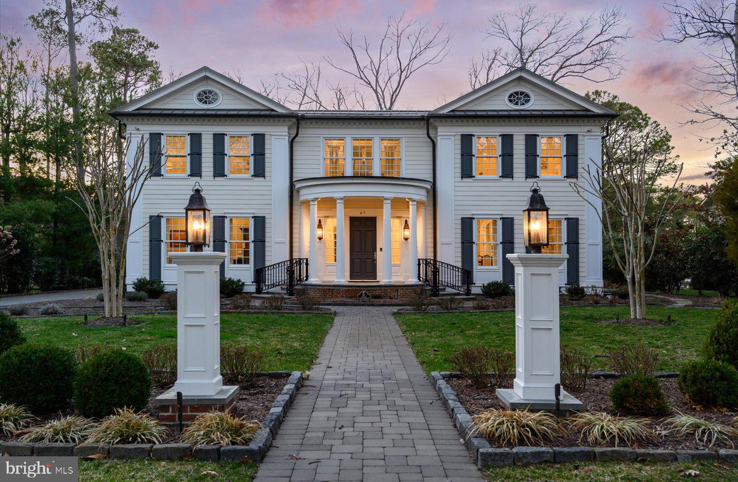 Exceptional canalfront living in prestigious Henlopen Acres. Perfectly positioned along the Lewes-Rehoboth Canal, this custom-built waterfront residence offers approximately 5,933 square feet of beautifully crafted living space with five bedrooms, five full baths, and one half bath. Built in 2014, the home showcases timeless architecture, exceptional millwork, and elegant finishes throughout. Designed for both everyday living and entertaining, the spacious floor plan features a gracious foyer, formal dining room, wood-burning fireplace, elevator, and a spectacular chef's kitchen complete with an oversized island, custom cabinetry, Sub-Zero refrigeration, and a coveted Lacanche French gas range. The luxurious primary suite is complemented by four additional ensuite bedrooms, while the unfinished basement provides abundant storage and future possibilities. Outdoor living is equally inviting with a screened porch, brick patio, beautifully landscaped grounds, and a private boat dock offering direct access to the Lewes-Rehoboth Canal, Rehoboth Bay, and the Atlantic Ocean. Additional highlights include a two-car garage and an unparalleled location just moments from the beaches, boardwalk, restaurants, and shopping of downtown Rehoboth Beach. 67 Tidewaters presents a rare opportunity to own an exceptional waterfront home in one of Delaware's most sought-after coastal communities.