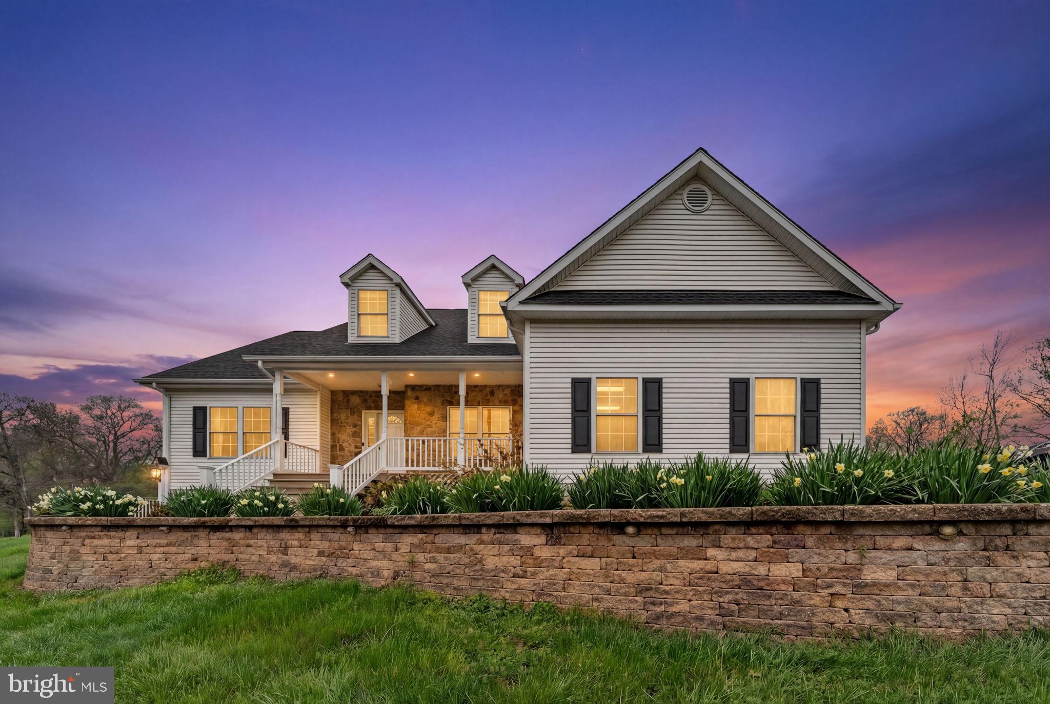 Set on an elevated homesite in Markham, this well-kept home offers a welcoming blend of comfort, space, and scenic surroundings. A stone-accented front façade, covered front porch, curved paver walkway, terraced retaining wall, and expansive front lawn create strong curb appeal, while the rear deck provides a great space to enjoy the open yard and peaceful setting. Inside, the home features beautiful stone fireplace, hardwood floors, a bright foyer, a stylish formal dining room, and an open kitchen with abundant cabinetry, generous counter space, bar seating, and a sunny breakfast area. The bedrooms are spacious and filled with natural light, and the baths feel fresh and updated. An unfinished lower level offers excellent storage, hobby, or future expansion potential. This is a property that combines attractive indoor living with usable outdoor space in a beautiful Fauquier County setting. Move right in  - all major maintenance items and upgrades have been taken care of including a new roof, whole house generator, new HVAC (and much more!) Complete list can be found in the document section. There's a shed for your lawn equipment and any "toys" and it's hard to beat this location for access to I-66 commuting east or west.