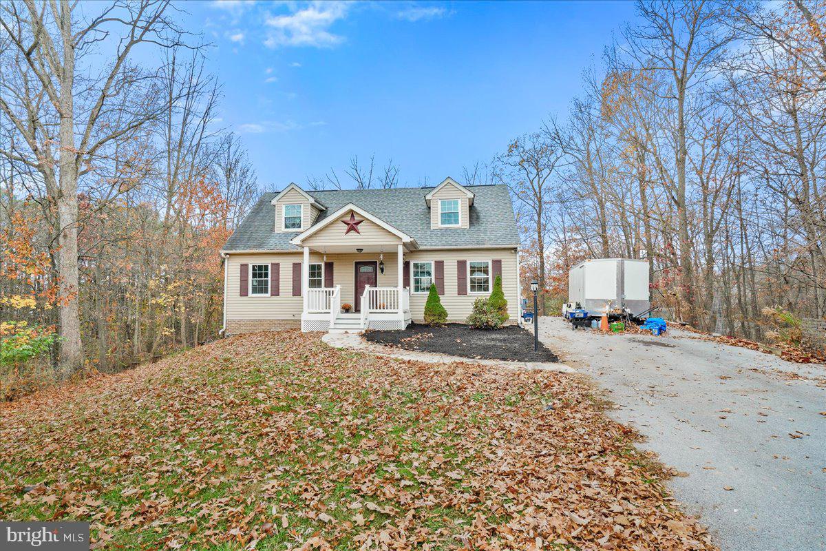 Discover the charm of this newly listed Cape Cod home nestled on a tranquil 1.6-acre, partially wooded cul-de-sac. Offering a delightful fusion of modern upgrades with natural scenery, this house provides both comfort and convenience in a serene setting.   Enjoy sitting on the front porch with the trex flooring and no maintenance railing.

Step inside to find a beautifully upgraded kitchen featuring stainless steel appliances, granite countertops, new cabinets, and a chic backsplash that adds a touch of elegance. The kitchen is equipped with a pantry for additional storage, ensuring you have all the space you need for culinary adventures.  From the dining room step out on to the large trex deck with no maintenance railings and enjoy entertaining guests and family.

This home boasts four cozy bedrooms.  Both bathrooms have been tastefully upgraded with tiled floors and showers, modern vanities, and new toilets, reflecting contemporary style and convenience.

Community features enhance the living experience with Emmanuel Christian School just a stone’s throw away, providing excellent educational opportunities. Nearby Heiskell Park offers a great spot for leisure and outdoor activities, while Hoffmans Quality Meats and Maugansville bus station are conveniently located, ensuring your practical needs are met swiftly.  Also, easy access to the Conococheague Creek for fishing and water activities and quick access to the Hagerstown Airport.

This property is an Estate Sale and is sold “AS IS”.    There is no flooring in the home, except for the bathrooms.   This home is ready for your finishing touches.   Updated items in 2015:   Roof, & HVAC, the Hot Water Heater is 8 years old.