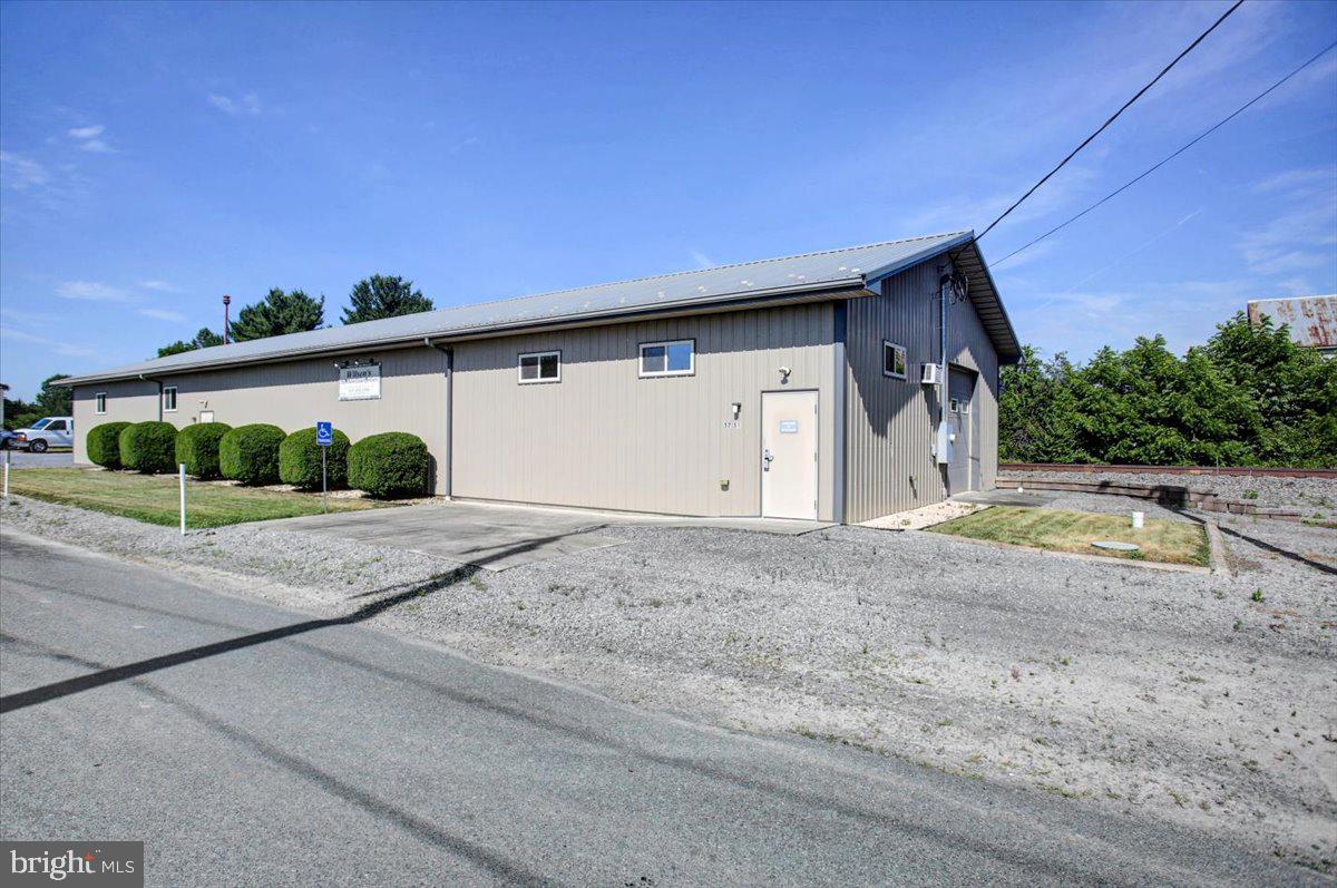 TURN KEY COMMERCIAL OPPORTUNITY!  Established cabinet shop with equipment, including paint booth & Compressor System.  Offers 56x38' workshop space; 25x18' showroom; 31x32' paint booth; 12' ceiling; 1/2 bath; (2) 10x10' OH doors and gravel parking area.