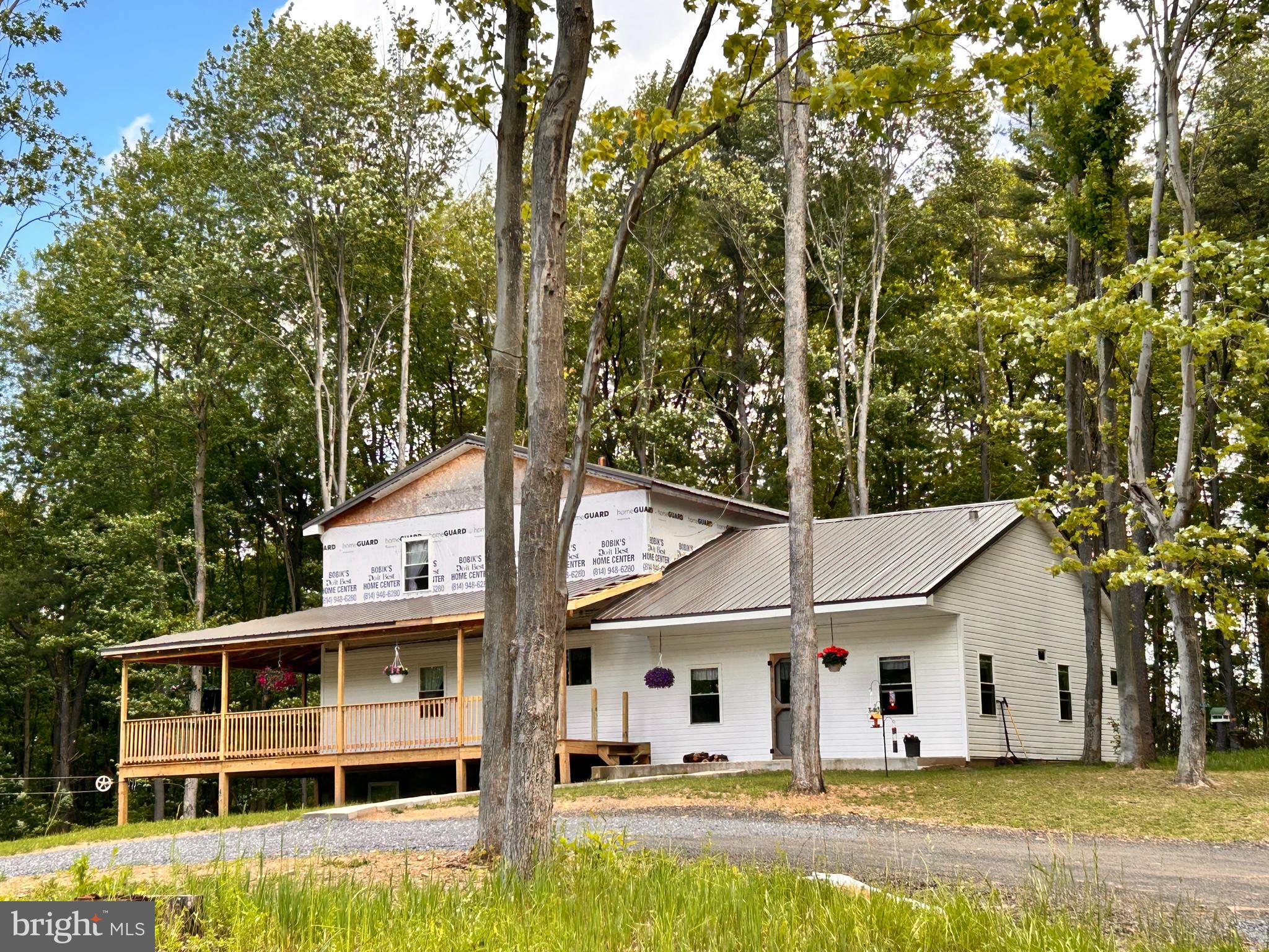 Nearly new home on 33 acres with large rooms and even more room to grow! Metal roof for efficiency on all the buildings. Outside you will enjoy the gorgeous views of mountains and fields from the wide wrap around porch. Perfect property to begin your homestead with a new 2 story barn with several stalls and feed area measuring 36x50 foot. Garage with open floor for shop or equipment measuring 36x70 foot