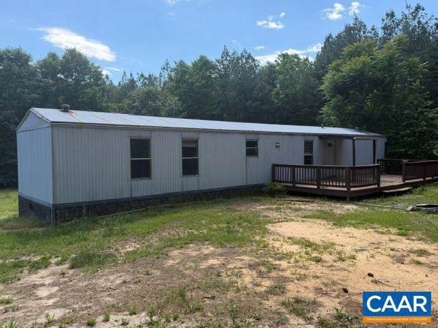 Discover the perfect blend of convenience, privacy, and potential on this beautiful 57-acre property in Buckingham County. With a well, septic system, and driveway already in place, much of the groundwork has been done for you. An existing mobile home provides immediate living accommodations, allowing you to stay on the property while planning and building the custom home you've always envisioned. Whether you're looking for a private country retreat, a family homestead, hunting property, recreational getaway, or future farm, this expansive tract offers endless possibilities. Enjoy the peace and quiet of rural living with plenty of room for trails, gardens, livestock, or simply taking in the natural beauty that surrounds you. Build at your own pace while enjoying the convenience of having essential utilities already established. Large metal carport for easy covered RV storage. Opportunities like this are hard to find?57 acres with existing infrastructure and a place to stay while creating your dream property.