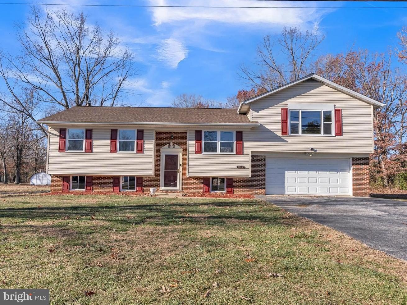 Welcome home! This house conveniently located in Pomfret, MD, got a fantastic makeover. Almost everything is new– flooring, fresh paint, shiny appliances, brand new HVAC system and new lighting throughout. But what makes this house special and sets it apart from competition is the PRIMARY SUITE. There's a big, cozy, private room that's like a secret hideout. It has its own fireplace that burns wood, recess lighting, spacious walk in closet, and a bathroom with a Jacuzzi-style tub. Plenty of space for storage/vehicles in the large attached 2 car garage. Enjoy the peace and tranquility overlooking your large 1+ acre yard from the brand new deck located just off of the kitchen. Hurry and you might get in before the Holidays-This one won’t last long!