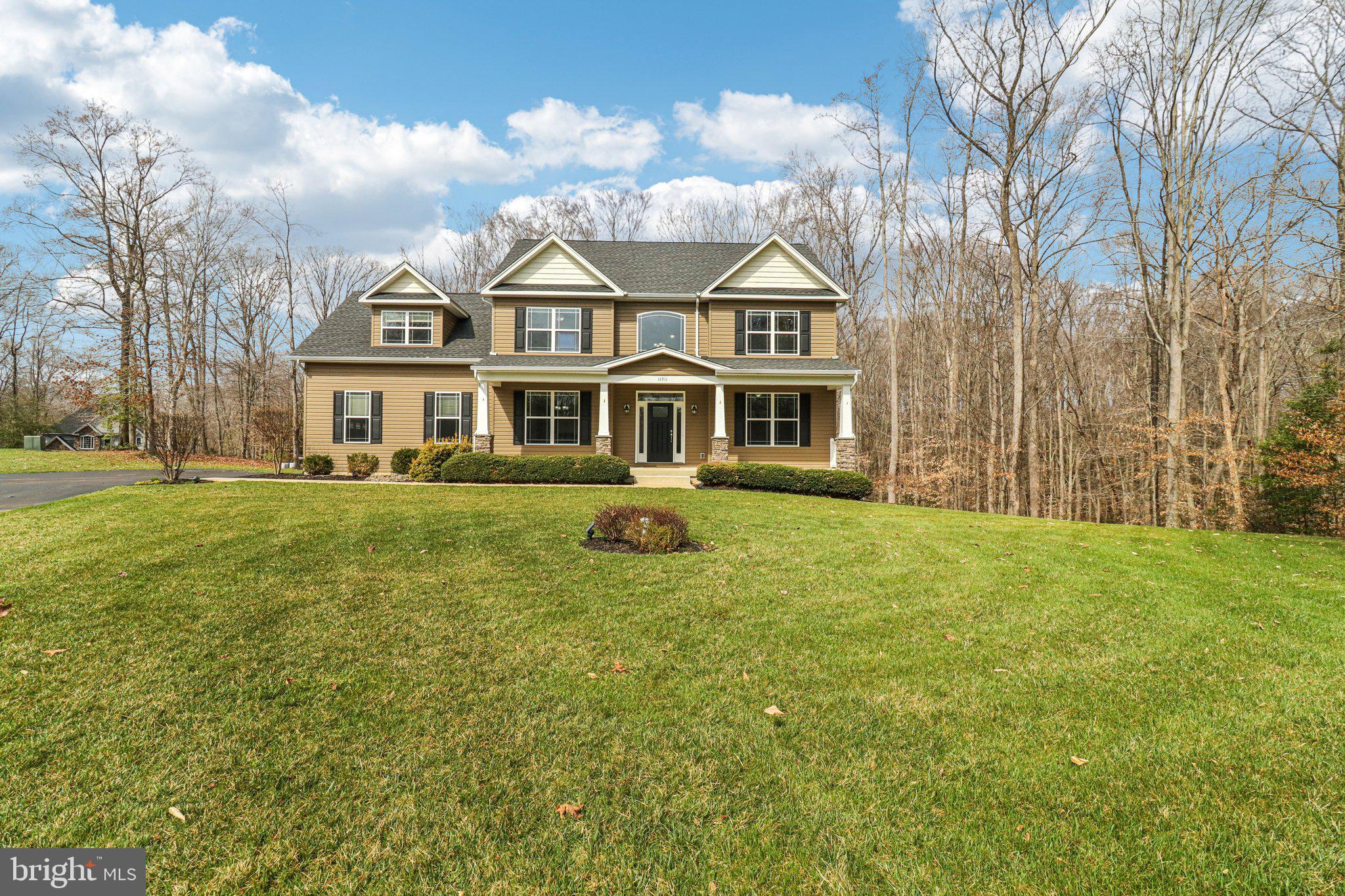Custom home on acreage in Hollybrook Farm. Tucked away on three private acres at the end of a peaceful cul-de-sac, this pristine Litz Custom Home offers the space, craftsmanship, and setting buyers are always hoping to find. Litz homes are known for their quality construction and thoughtful design, and this property showcases that reputation beautifully. The welcoming front porch invites you to slow down and enjoy the surrounding nature before stepping inside to a two-story foyer with gleaming Cameroon timber floors, one of the hardest woods on the planet and best protection from scratches from pets or high traffic. The foyer opens to formal living and dining rooms with 9-foot ceilings, creating an elegant space for entertaining while still feeling warm and comfortable for everyday living. The kitchen is designed for gathering, featuring upgraded countertops, stainless steel appliances, abundant cabinetry, and a sunny breakfast area. Just off the kitchen, the family room offers a gas fireplace and surround sound with large windows bringing natural light into the heart of the home. In 2021, the owners expanded the living space with a composite deck and a stunning 14×14 sunroom, creating a seamless connection between indoor comfort and outdoor living. Whether it’s morning coffee, quiet evenings, or hosting friends, this space quickly becomes a favorite. Upstairs, you’ll find four spacious bedrooms, including an owner’s suite with tray ceiling and rope lighting. The owner’s bath features a large walk-in shower, centric soaking tub, and dual sinks, creating a comfortable retreat at the end of the day. On the opposite side of the level, the bonus room over the garage provides incredible flexibility and could easily function as a second owner’s suite, guest retreat, or private office, with convenient access to the full hall bathroom. The finished basement adds even more living space, offering a large recreation area, a full bathroom, room for an additional bedroom if desired, and a custom dedicated dog-washing station that pet lovers will appreciate. Additional highlights include gas on-demand hot water, a front and backyard irrigation system, and a 16×24 two-level shed with electricity and 200-amp service, plus a lean-to for tractor or equipment storage. With abundant storage and thoughtful features throughout such as the "Christmas Lights" upgrade offering specializes electrical access for seasonal/holiday lighting and water/electric on the rear deck, this property offers both functionality and charm. Located close to schools, shopping, and major commuting routes, Hollybrook Farm offers the privacy of acreage living while still being convenient to everything you need.