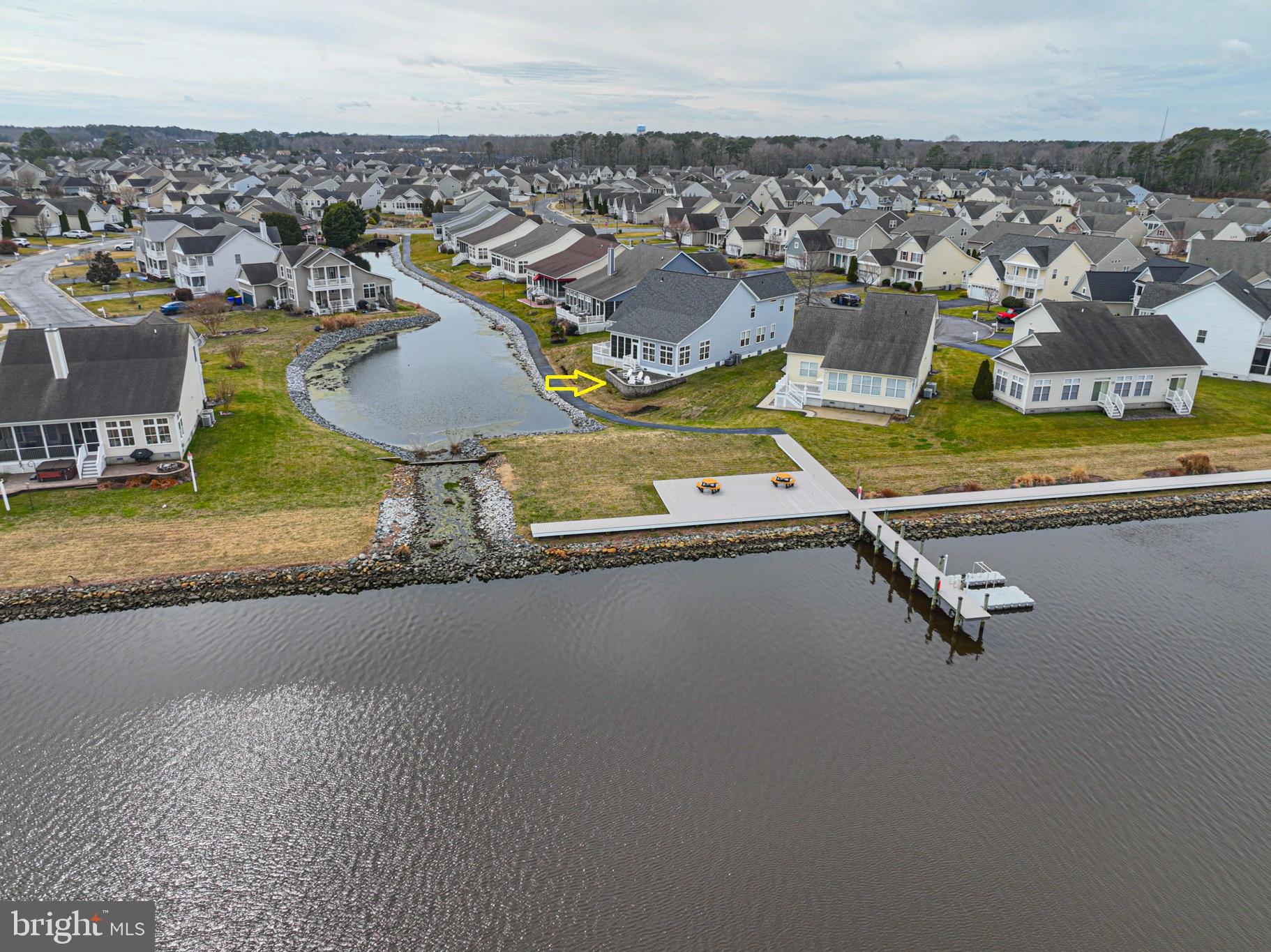 Stunning Waterfront Views: Perfectly positioned at the end of a quiet cul-de-sac in the sought-after location within Swann Cove community, this coastal home offers breathtaking views of the bay and pond. Designed for both comfort and coastal vibe, the residence features five bedrooms and five full baths, along with a versatile flex room currently used as a sixth bedroom—ideal for accommodating family and guests. The main level offers a thoughtfully designed layout highlighted by a spacious great room with expansive water views, a well-appointed kitchen with center island, and a first-floor primary suite. Also on this level are an additional bedroom with full bath, a den, a private office, another full bath, and a convenient laundry room located just off the oversized two-car garage. Outdoor living is a standout feature of the home. Just off the great room, a three-season porch and open deck overlook the beautifully landscaped paver patio, where the panoramic views of the Dirickson Creek and Swan Cove pond create an unforgettable backdrop for relaxing or entertaining. The second level offers additional living space with a loft currently used as a cozy TV and reading nook, a separate rec/game room, and three additional bedrooms with two full baths, providing plenty of room for family and guests. Located just a short walk from the community kayak launch, dock, and bay access. Swan Cove also offers an array of amenities including an in-ground pool, fitness center, community pier and dock, playground, and walking paths. The community does allow weekly rentals, making it an excellent opportunity as a primary residence, coastal retreat, or investment property. Ideally located just three miles from the beaches of Fenwick Island and Ocean City, with convenient access to shopping, dining, golf, and the popular Freeman Arts Pavilion.
Offered partially furnished, this remarkable home is ready to be enjoyed. Private showings only.