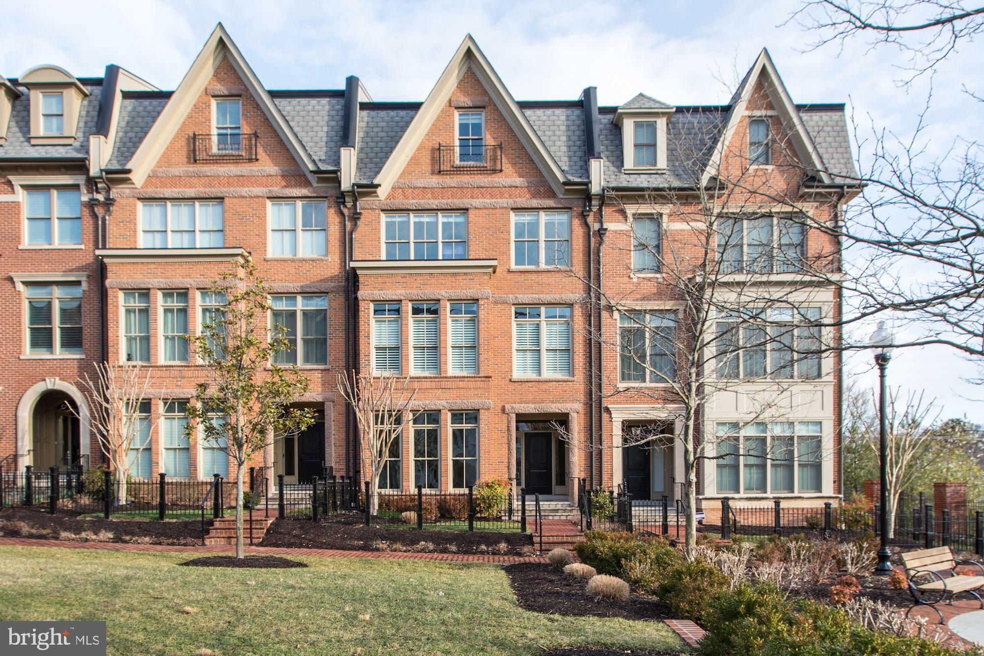 OFF MARKET, SELLER HAS DECIDED NOT TO MOVE.Exceptional offering in the serene 7-year-old Symphony Park community at Strathmore Park, this is a luxury 4-level elevator townhome built to the highest standards by Michael Harris Homes. Offering 3850 square feet of finished above ground space, the house shows at its finest, with so many upgrades, including fine carpets, decorator paint and fixtures, hardwood floors and built-ins on all 4 levels. The owner's joy in this residence reflects its superior location in the community, facing a landscaped mews/courtyard and offering views of the nearby pond, walking path and playing fields; and is shown in the lovely interior decor.  Each spacious level offers a flow from room to light-filled room. The entry level offers a lovely foyer, a library which can serve as a bedroom, an office/exercise room, full bath, garage and elevator access. The main level offers a smashing kitchen with large center isle and every appliance, opening to the family room with gas fireplace and large balcony beyond. The spacious dining room opens to the living room, providing elegant space for entertaining. Upstairs, the master bedroom suite offers a sitting area, two walk-in closets and luxury master bath with tub and shower. The upper level offers a large family/entertainment room with wetbar, a guest suite including bedroom and full bath, and another large balcony.  High ceilings add to the spacious feel, and the house shows in pristine condition. Custom plantation shutters, designer lighting, custom kitchen backsplash, Viking 6-burner stove, Bosch dishwasher, wine frig, added built-ins custom-built by a master carpenter including bookshelves, panty and broom closet; upgraded bathroom tile, added trim and moldings - all combine to make this property a complete delight! Located within steps of Grosvenor metro, buses, shopping, restaurants, and access to I-495, the location offers every benefit of urban/suburban life in North Bethesda. Some furnishings may convey. Seller has asked that listing be shown using Maryland covid-19 public safety restrictions.
