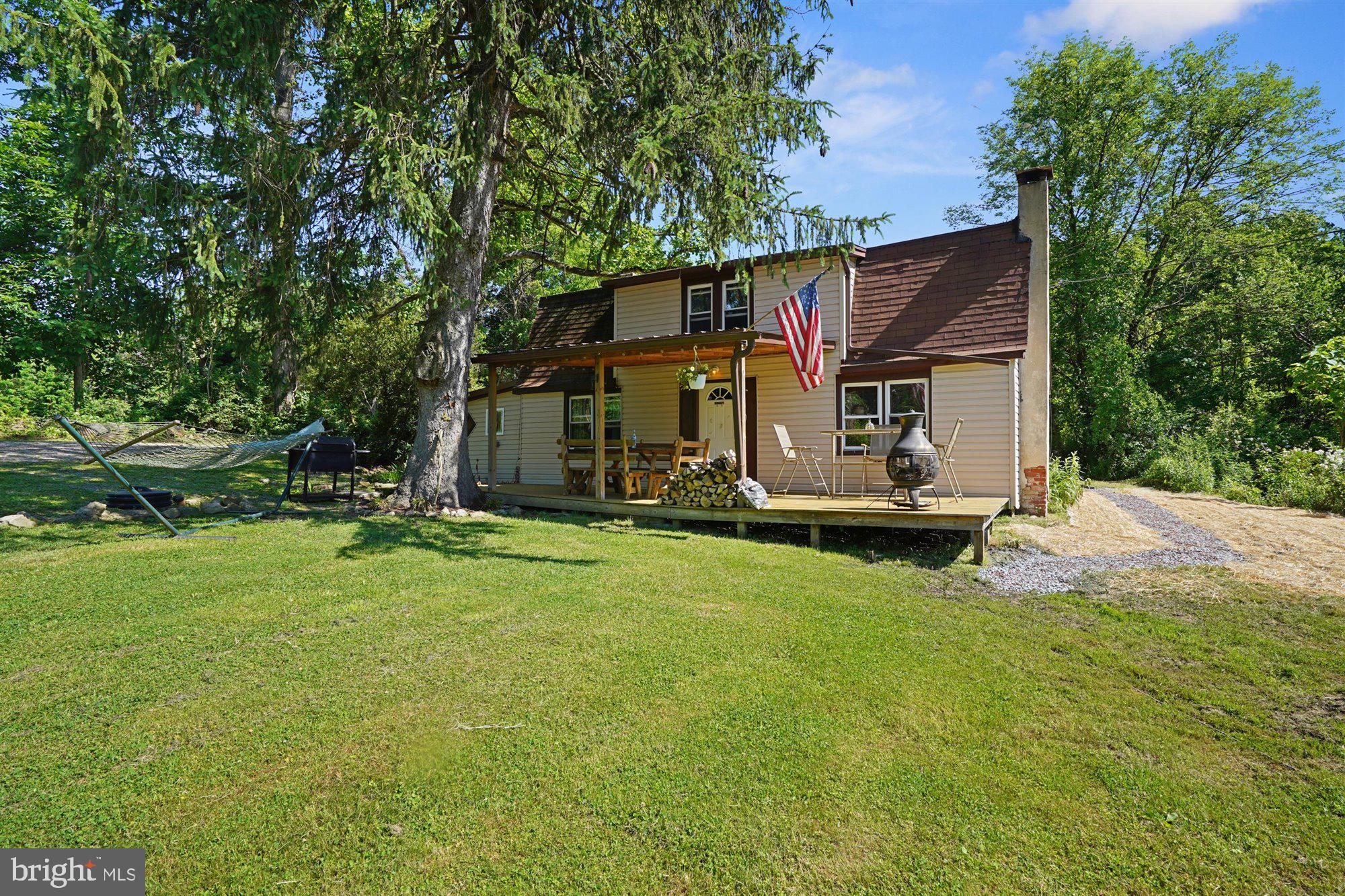 Welcome to 11 Robin Lane! Your very own private oasis! Located in Oley Schools, on a private lane, down a long gravel driveway, you will find this lovely 2 bedroom cape located on a large 2.51 acre lot. As you head inside, you will enter the living room that has a pellet stove guaranteed to keep you warm throughout the winter. To the left is the kitchen, full bath, and laundry area. As you walk past the living room, you will get to the spacious bar room which is perfect for entertaining. Exit out that door, and to your left will be the half bathroom that could easily be converted into a full. Heading upstairs, you will see the second bedroom to your right and the primary bedroom to your left. Outside, as you drive down the driveway, you will appreciate the wooded privacy that the front portion of the lot offers. You will also fall in love with the beautiful pond that is home to plenty of fish, the detached garage/shop, the amount of open space and parking in the rear, and the cozy front porch. Located close to route 12, you will enjoy the convenience factor of being 15 minutes from Reading, but far enough away from the hustle and bustle. Schedule your tour today before it is too late.