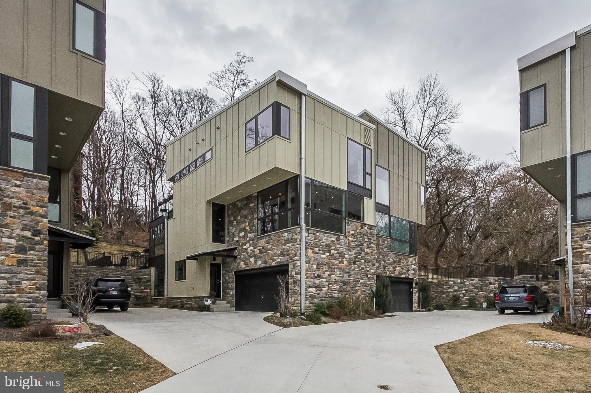 Custom Contemporary "green"  home! Open floor plan w/windows everywhere. Kitchen & bath upgrades. Beamed/wood ceilings on main level. Gutierrez staircase. Custom solar shades. LR w/gas FP. Sunroom overlooks oversized deck, stone patio & deep fenced yard. Backs to 700 ac park.  3-4 BR, 3.5 baths. Built to LEED Silver standards. Walk to Light Rail, Woodberry Kitchen. Clipper Mill pool.  2700 sq ft.