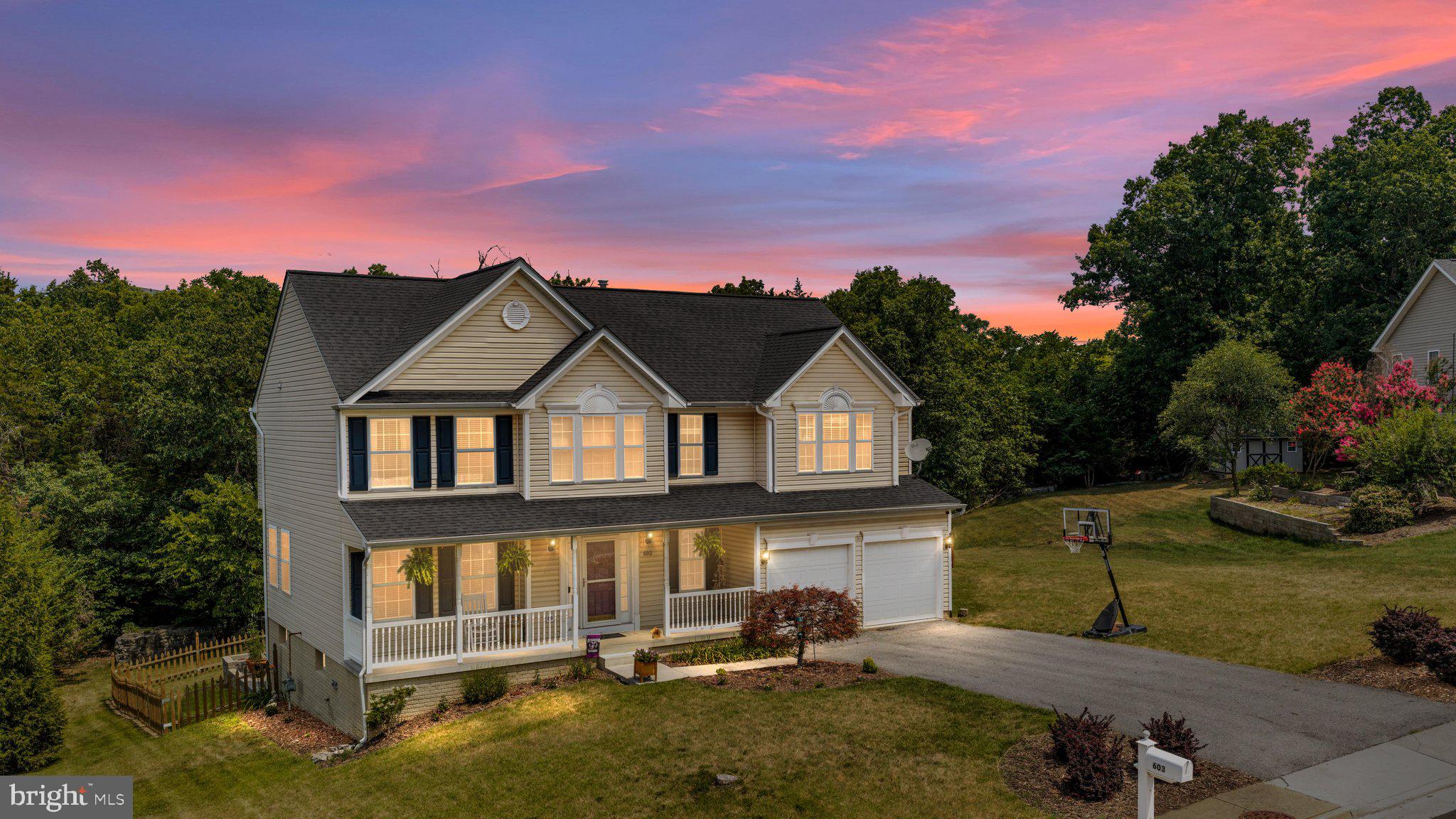 Welcome to this stunning 3-story Colonial in the highly sought-after Crystal Hill Subdivision, offering over 3,300 square feet of beautifully finished living space with 5 bedrooms, 3.5 bathrooms, and a floor plan designed for both everyday living and entertaining.

Step inside the impressive two-story foyer and you'll immediately appreciate the warmth of the hardwood flooring that flows throughout most of the main level. The spacious living room, formal dining room, bonus room, half bath, and convenient mudroom/laundry room provide both comfort and functionality. The heart of the home is the beautifully appointed kitchen featuring granite countertops, stainless steel appliances, gas cooking, tile backsplash, track lighting, white cabinetry with black hardware, and a breakfast area with direct access to the rear deck—perfect for morning coffee or outdoor dining.

Upstairs, retreat to the expansive primary suite featuring a cathedral ceiling, oversized walk-in closet, and a luxurious ensuite bath with a double vanity, soaking tub, and tiled walk-in shower. Three additional generously sized bedrooms and another full bath complete the upper level.

The finished walkout lower level offers incredible versatility and is ideal for multi-generational living, in law suite, extended guests, or additional entertaining space. It features a kitchenette with granite countertops, white cabinetry with black hardware, shelving, refrigerator, and microwave, a spacious family room highlighted by a decorative electric fireplace with a custom shiplap accent wall, a fifth bedroom with a large walk-in closet, a bonus area with custom window seats and built-in storage, and another full bathroom.

Enjoy spending time outdoors in the fenced backyard featuring a spacious stone patio with a fire pit, a rear deck with white vinyl railing, a storage shed, and additional yard space extending beyond the fenced area.

Conveniently located just minutes from I-81, I-66, shopping, restaurants, breweries, and everyday conveniences, this beautifully maintained home offers the perfect combination of space, style, and location. Schedule your private tour today and experience everything this exceptional property has to offer.