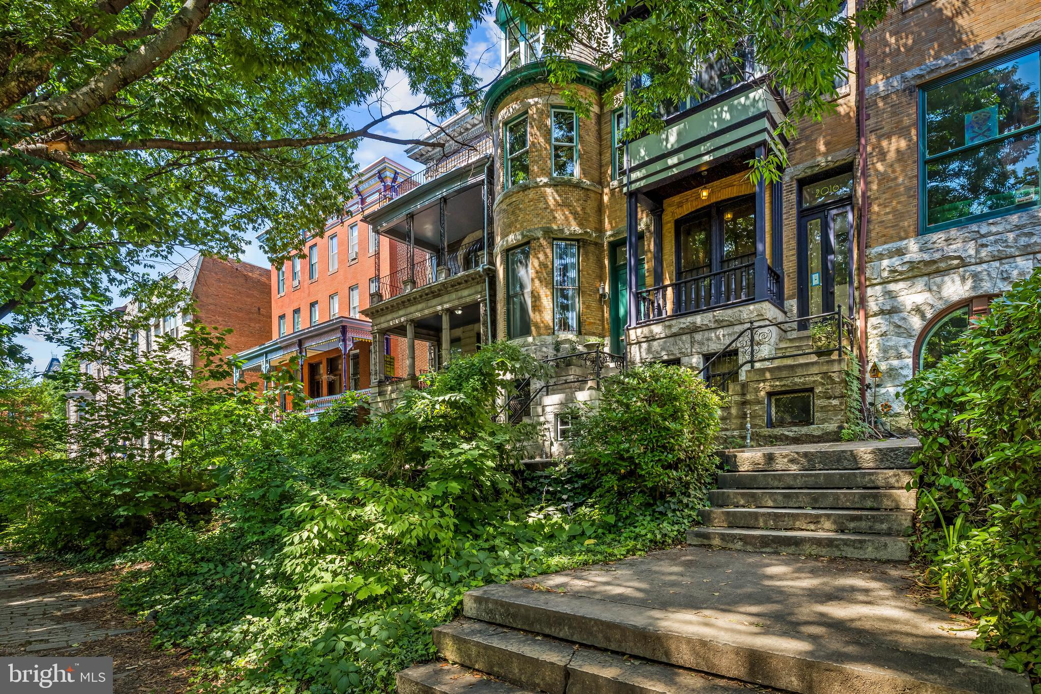 A House Designed for the View -- When this home was built c.1890, its elegant bowed windows overlooked Baltimore's Mount Royal Reservoir, one of the City's most celebrated scenic promenades where carriages entered Druid Hill Park. The Reservoir Hill Historic District's nomination to the National Register of Historic Places notes that these houses were specifically designed with projecting bays, porches, and balconies to maximize those views. Its location within what the City designates as Mount Royal Terrace Historic District reinforces that recognition the homeowners will enjoy. The original intent remains beautifully intact after the Reservoir was retired in 1924. Lady Baltimore Park now captivates the view  from all front rooms that frame a canopy of mature trees, creating the remarkable "treehouse" feeling with a cooling cross-draft and magical quality that first captured the Sellers interest. From the walk-out ground level in-law suite to the third-floor high ceiling bedroom, the trees and chirping birds make its being a City dwelling scarcely believable. Sellers describe watching a falcon nest in the nearby trees as being a remarkable sight among their treasured home memories. Both Sellers worked in DC when they purchased it and walked to Penn Station through Bolton Hill. Proximity to the Meyerhoff and performance centers can be enjoyed.  This house is perfectly placed between the city's cultural life and its green spaces -- particularly noted in the restoration of Druid Hill Park, The Lady Baltimore Park, which is a City Park, has a wonderful Victorian character that offers a peaceful sanctuary. The rear deck was enlarged and a spacious covered patio was added, creating an outdoor room to enjoy most of the year. The comfortable finished basement's au pair suite offers a front ground-level entrance and has been enjoyed by grandparents, relatives, and friends visiting from overseas, many of whom stayed for weeks at a time. The exceptionally high ceilings, ornate plaster moldings, magnificent marble fireplaces, decorative effect of unused pocket doors and transoms, elegant central staircase, tall skirting boards, and countless original details have been beautifully preserved. Even the second-floor bathroom still has its original clawfoot bathtub with brass fittings that prompted the Sellers to consider themselves caretakers of a remarkable piece of history.  A feature the Sellers have especially loved is the house being raised above the street by its magnificent marble staircase. The front parlor, with its bay windows overlooking the Park, became a favorite place to linger over breakfast while watching the seasons change in the trees. These extraordinary houses are enhanced by a genuine sense of community in a remarkable neighborhood.