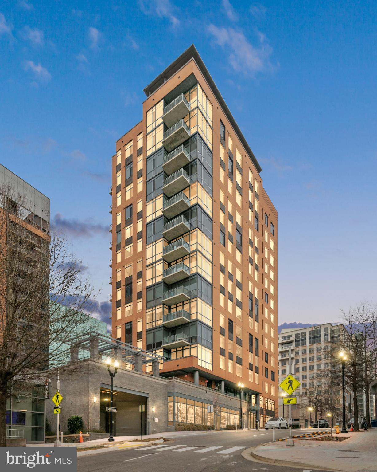 An exceptional residence at 2000 Clarendon, the newest condo building in Arlington, offering 10ft soaring ceilings, a view of the National Cathedral, beautiful high-end finishes, and excellent amenities with a WalkScore of 97 out of 100. <BR><BR> AN EXCEPTIONAL CONDO. Residence 504 has been lightly lived in by the current owner and is the closest you can get to new construction in Arlington. The uniquely high ceilings and oversized windows fill the rooms with natural light, with a view of the National Cathedral from the living room. Custom closet storage, designer finishes, and a versatile living/dining space create a home perfectly suited for rest, work, and entertainment. The rent includes a large, conveniently located parking space and includes all utilities except electric, internet, and tv. <BR><BR> EXCELLENT AMENITIES IN A NEW BUILDING. At 2000 Clarendon, residents enjoy an extensive amenity package, including a two-tier outdoor pool and terrace, a rooftop with panoramic views, a rooftop club room, a fitness center, a package room, and on-site management.  <BR><BR> A PREMIER LOCATION WITH 97/100 WALKSCORE. Easily walk to Whole Foods/Trader Joes, Metro, endless restaurants and bars, specialty fitness classes, shopping, and parks. Stroll across the Key Bridge to Georgetown, across the Memorial Bridge to the Washington Mall, or job/bike the Mount Vernon Trail with scenic vistas of the Potomac and Washington Monument along the way. Minutes to Reagan National Airport and a short trip to Dulles International Airport, both accessible by Metro. Zip to downtown DC, Old Town Alexandria, Tysons, and more within minutes.
