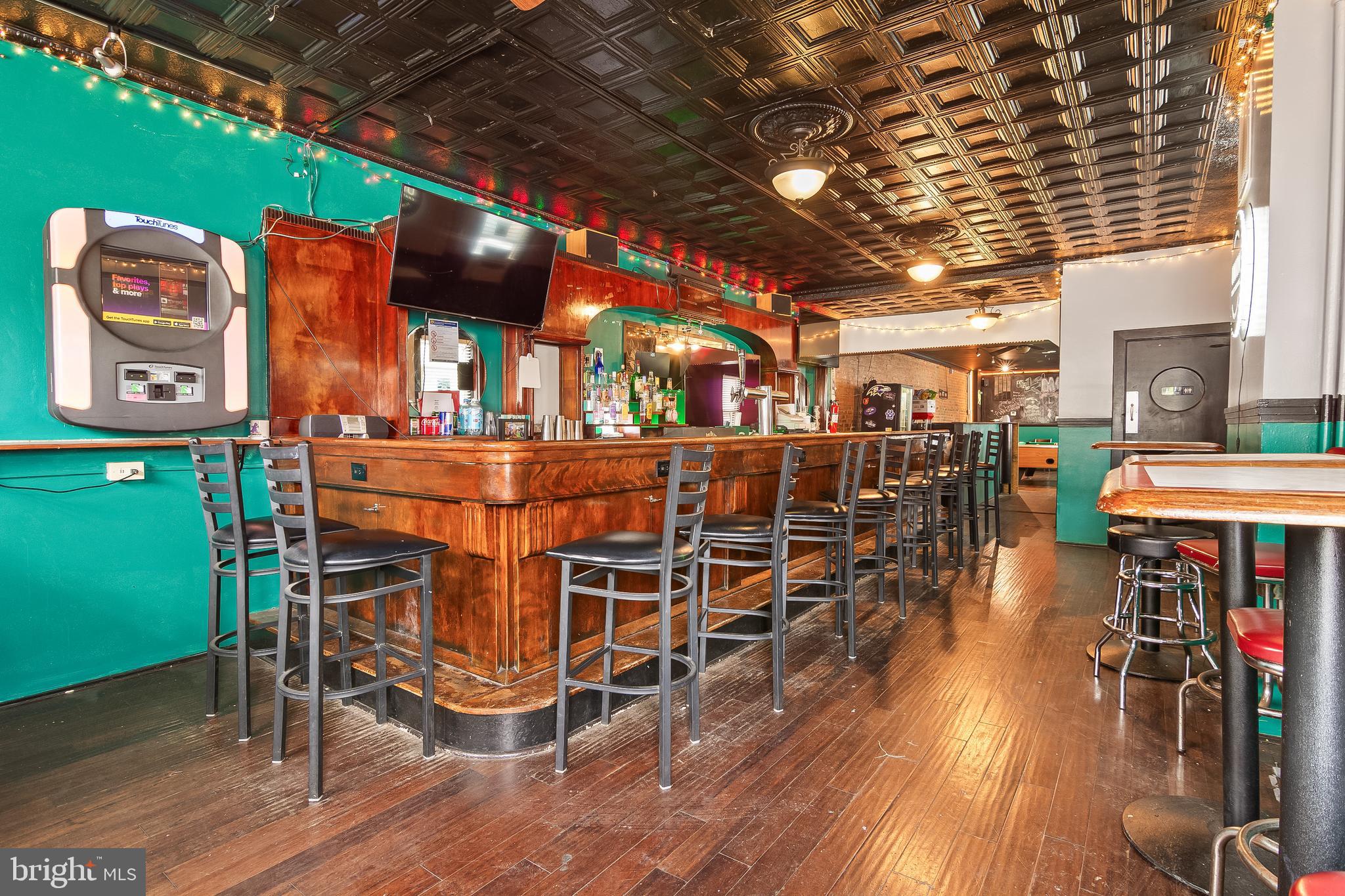 Exceptional multi-use investment opportunity in the heart of Downtown Baltimore. This historic mixed-use building features an operating bar on the main , and a 2 bedroom apartment upstairs, creating multiple income-producing opportunities for investors.

Perfect for buyers looking to expand their rental portfolio, the property offers strong potential for cash flow, long-term appreciation, and value-add potential. With excellent visibility, steady foot traffic, and flexible mixed-use appeal, this property is ideal for seasoned investors, entrepreneurs, or owner-operators seeking a prime downtown location.  Liquor license is included in the sale.