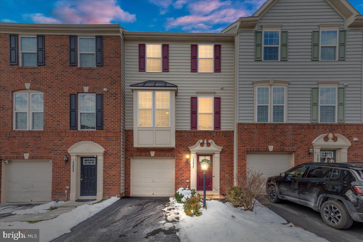 Welcome to this stunning rarely available 4-bedroom townhouse, within The Townes of Autumn Oak community! Step into a world of comfort as the main floor welcomes you with beautiful oak floors and an abundance of natural light with the east facing bay windows in the morning sun. The open concept layout provides a seamless flow between kitchen and living, while still offering multiple dining and seating options for gatherings. The kitchen is a chef's delight, featuring a breakfast bar, island, and a spacious dining area. Whether you're entertaining guests or enjoying a family meal, this space is designed for both functionality and style. Of the two separate floors of bedrooms, venture to the top floor where luxury awaits in the oversized master bedroom complete with a walk-in closet. Topside laundry adds convenience to your daily routine, and two additional bedrooms. Step outside to the backyard oasis – a spacious and fully fenced retreat. Relax in the sunset on the large outdoor deck, surrounded by the privacy and serene views of trees. Direct access to the community walking path from your backyard and a quick 10-minute walk will bring you to the famous W&OD biking and jogging trail that stretches from Leesburg to beyond Vienna. Nearby to the Herndon public golf course, indoor and outdoor tennis and an award winning community center. Close to Reston Town Center, Dulles Town Center, Old Town Herndon, Route 28, the Dulles Greenway, Chantilly, Ashburn, and One Loudoun. The home is a quick 8-minute drive to Dulles International Airport and is central to commuter routes and in the heart of the Dulles Tech Corridor. Minutes away from Route 28 Silver Line Metro.  Don't miss the opportunity to make this dream home yours – where sophistication meets practicality in a perfect harmony of space, style, and location.