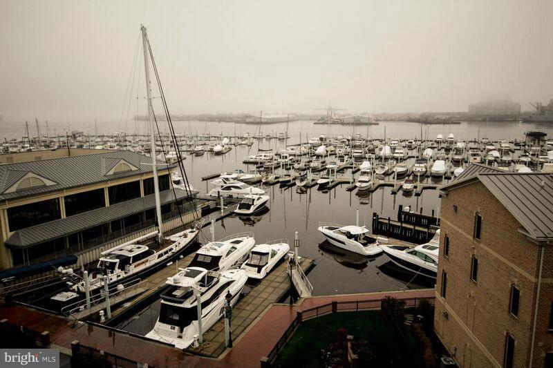 Fantastic WATERFRONT corner unit condo 3B. 2FB in Canton - 2 parking garage, balcony facing spectacular view of the Marina and Inner Harbor, hardwood floor, gourmet kitchen with SS appliances, granite counter top and breakfast bar-Master bedroom with walking closet-24h security front desk - walking distance to the new Canton Square Mall! Easy access to JHP, 95, 695, 895.