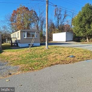 Older but well maintained singlewide mobile home on .57 Ac. Private location.  Public water and septic.   New within the last 6 years, rubber roof, heat pump, windows, doors and skirting.  Freshly painted. Own for less then rent.  Live in the mobile while you build, use as rental or make this your home.  Near MD border and the Potomac River. Special Financing Required Pre-1976 Construction.