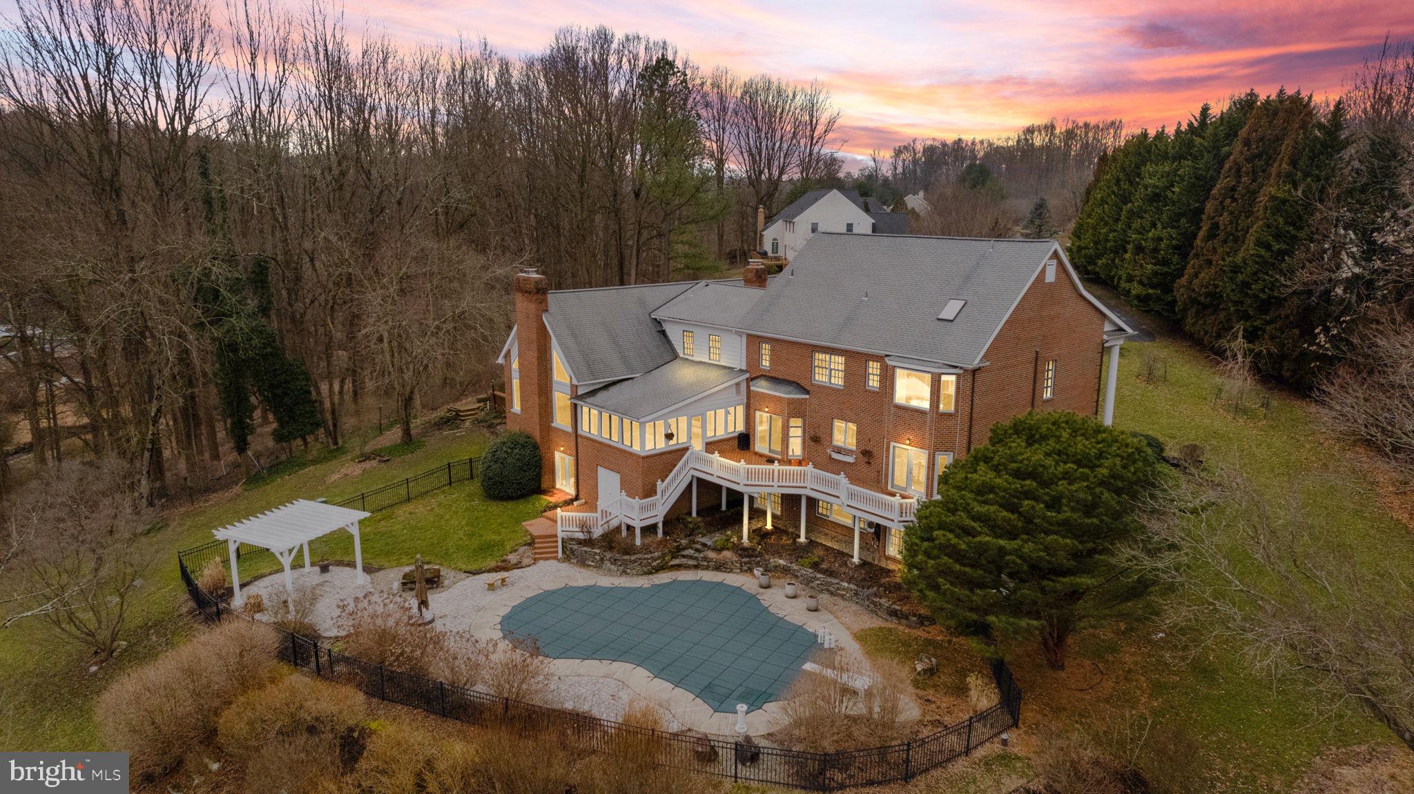 Indulge in the luxurious ambiance of this meticulously maintained, all-brick, federal-style home situated at the end of a tranquil cul-de-sac in the award winning Unionville-Chadds Ford School District. The residence has been freshly adorned with new paint and carpets, enhancing its allure. Every glance from the windows reveals captivating views, complemented by carefully cultivated specimen plantings, a flourishing fig tree, and a delightful array of annuals and perennials. Step into your private oasis where an inviting in-ground swimming pool stands ready to host summer festivities. The interior exudes sophistication with oversized crown moldings, gleaming hardwood oak flooring, and a gourmet cherry wood kitchen adorned with Juparana bronze granite countertops, a 4" backsplash embellished with travertine tile, and a spacious breakfast room leading to a secluded deck. A spiral entry staircase adds a touch of elegance, while the inclusion of an in-law suite, an office or guest bedroom with a full bathroom, formal living and dining rooms, and a library, enhances the home's versatility. The expansive family room features a cathedral ceiling and a distinctive bullnose herringbone brick fireplace, complemented by a four-season room offering flexible living space. Upstairs, the second floor boasts five generously sized bedrooms, including a main suite and a princess suite, along with a large walk-up attic. The sunlit lower level is a haven for relaxation, complete with a full bathroom and direct access to the pool. Additionally, the unfinished section provides a dedicated garden and workshop area, coupled with ample storage space. Strategically positioned, this property offers convenient access to major routes, the Philadelphia International Airport, shopping, restaurants, recreation, and prestigious award-winning schools. You'll also enjoy the added assurance of a state-of-the-art Kohler 60 KW whole-house generator seamlessly integrated with an automatic transfer switch, all powered by a substantial 1,000-gallon in-ground propane tank. Seize the opportunity to make this remarkable residence your own, and relish in the pride of calling it home for years to come.