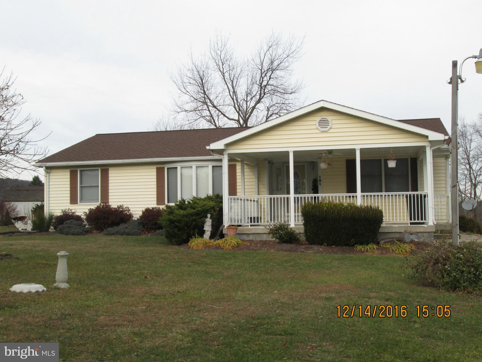 Meticulously maintained rancher on 2 cleared acres. This spacious home offers large rooms, formal living room, dining room, eat-in kitchen, large family room with pellet stove. The screened in gazebo and Trex decking are perfect for outdoor entertaining.  Relax on the large, covered front porch. Lot is level and features fenced rear yard & shed. Just minutes from town, convenient for commuters!