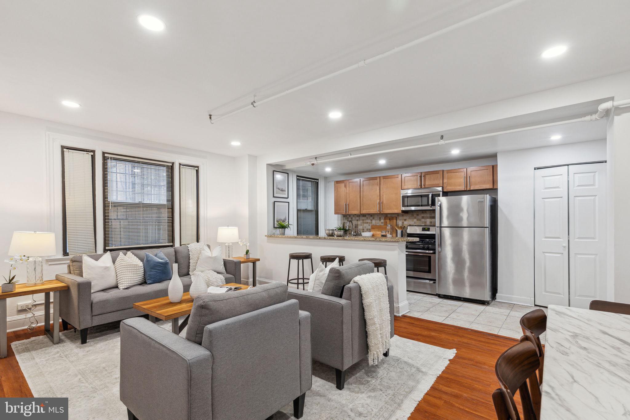 Renovated 2 bedroom/1 bedroom + den residence with a designer kitchen and laminate flooring at The Carlyle! The home features a high-end kitchen with maple shaker cabinetry, stainless steel appliances, granite countertops, mosaic tile backsplash and a large breakfast bar; a spacious living/dining room with ample space for entertaining; two bedrooms (or one bedroom + den) that enjoy use of a full hall bathroom with a shower/tub and mosaic glass tile detail; and a washer/dryer for added convenience.  The Carlyle is a pet-friendly, doorman building only one block from Rittenhouse Square. Rent includes the security of a 24-hour doorman and use of the building's state-of-the-art gym. Tenants are responsible for paying all utilities.