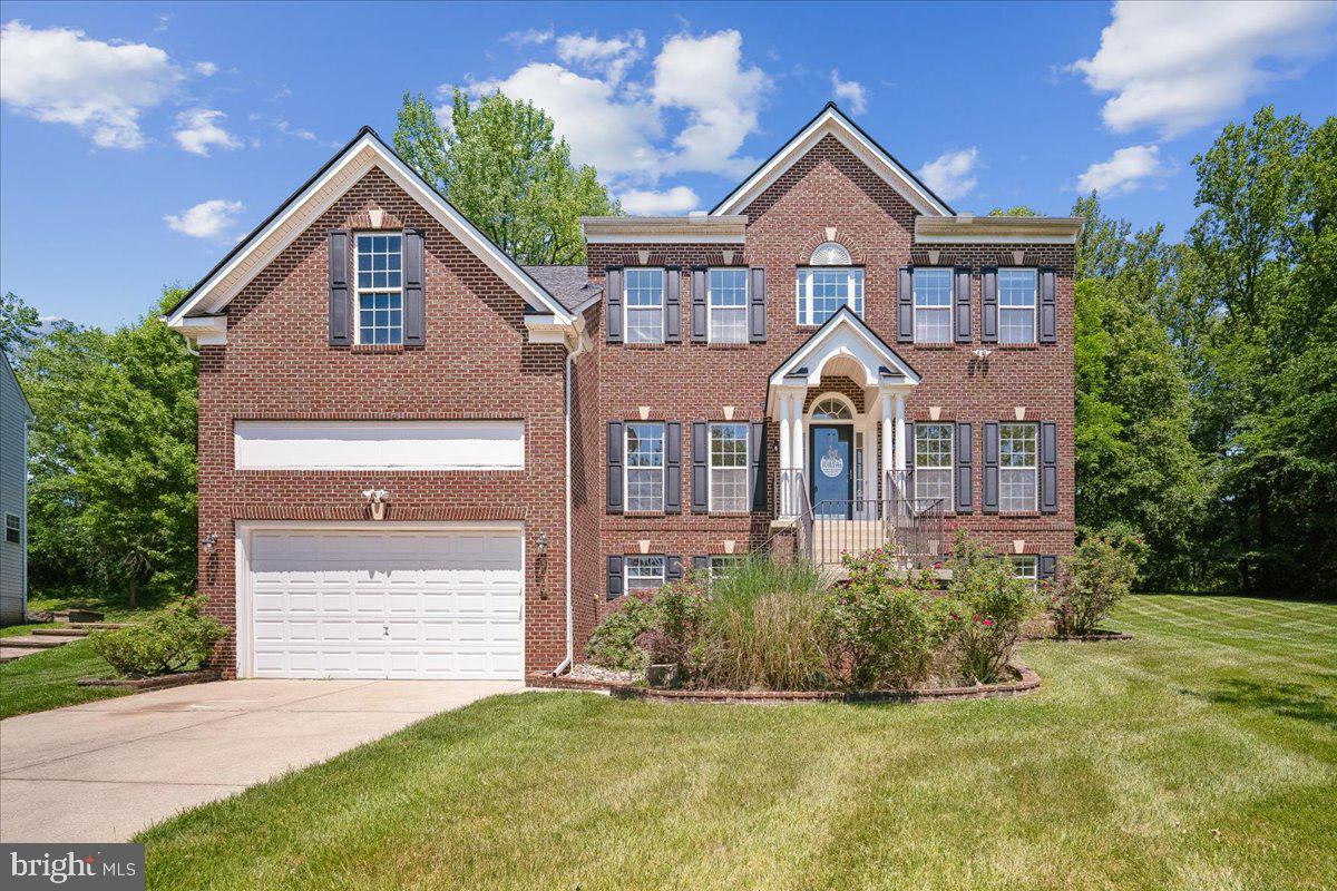 Tucked away on a peaceful cul-de-sac in Glenshire Estates, this stunning brick front colonial style home offers the perfect blend of elegance and everyday comfort. With five generous bedrooms and four full bathrooms, this versatile floor plan provides space for family to come together for life's best moments.
Enter and admire the graceful interior columns that frame your formal living and dining areas, setting the stage for memorable gatherings and quiet evenings alike. 
The heart of this home centers around the great room which beckons with a cozy fireplace, and a thoughtfully designed well appointed kitchen with your choice of gas or electric cooktop which opens to a large deck ideal for morning coffee or summer barbecues. 
Upstairs, complemented by a luxurious bathroom, the spacious primary bedroom awaits with an optional sitting area, offering a private sanctuary to unwind. 
The finished basement expands your living possibilities with a fitness space that offers flexible use options. Movie enthusiasts will fall in love with the dedicated movie room featuring a wet bar and built-in surround sound speakers, perfect for those cinematic experiences without leaving home. Outside, the generous outdoor space provides room for gardens, play areas, or simply enjoying the fresh air.
Recent updates include a new HVAC system, giving you peace of mind for years to come. Conveniently located close to shopping and transportation, this location truly has it all.