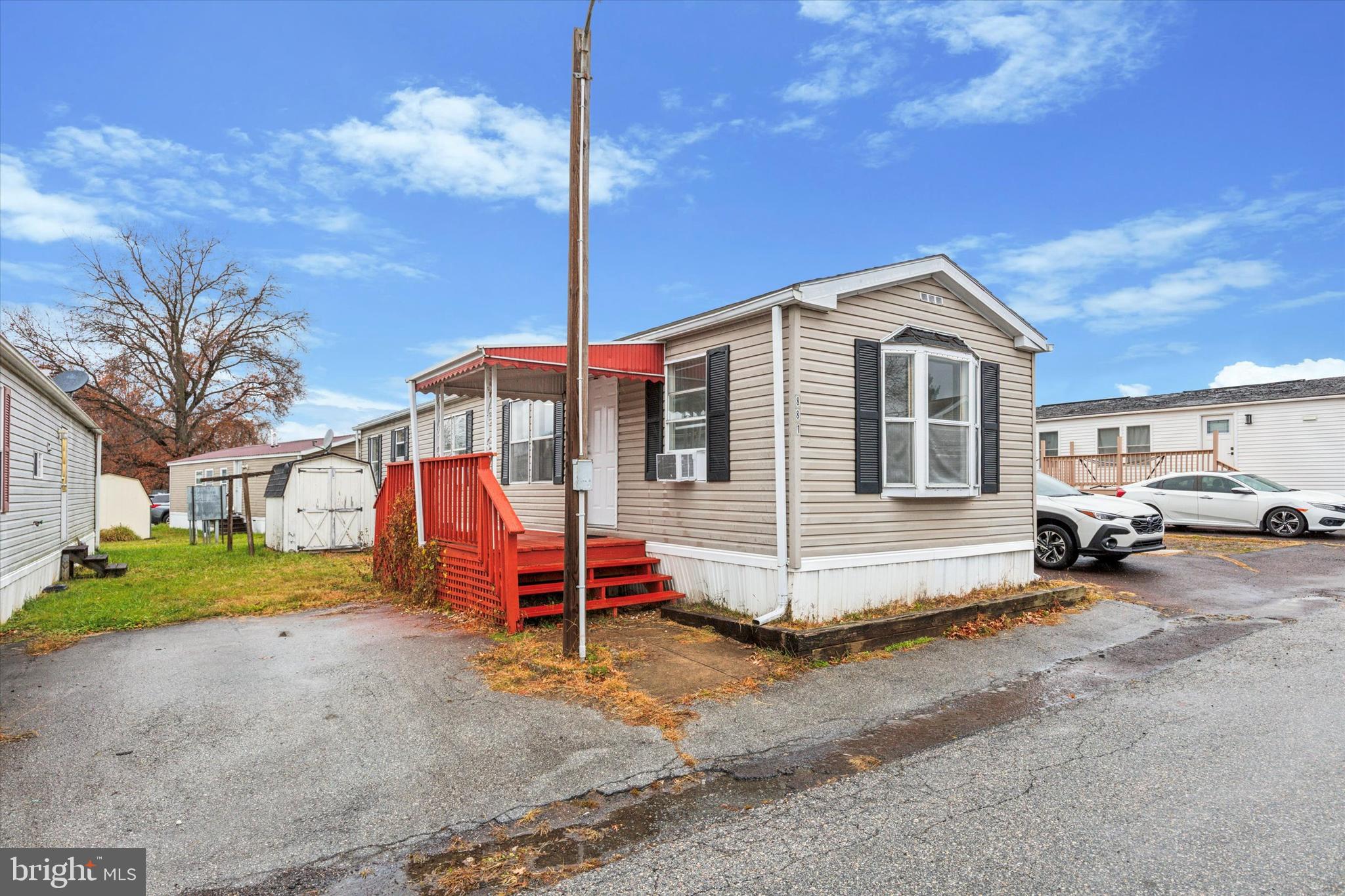 Welcome to this charming 2 bedroom, 1-bath manufactured home in the desirable Spring City Community! Perfectly designed for easy living, this home offers a bright and spacious layout, featuring an open-concept living area that flows into a well-equipped kitchen with a countertop, built-in microwave, and plenty of cabinet space. The sale includes a washer and dryer (as-is), making this home move-in ready. Outside, you'll find two convenient off-street parking spaces, making it easy to come and go. The lot rent is 825.  The lot rent includes water, trash, and sewage—providing you with a worry-free lifestyle. Make your appointment today!