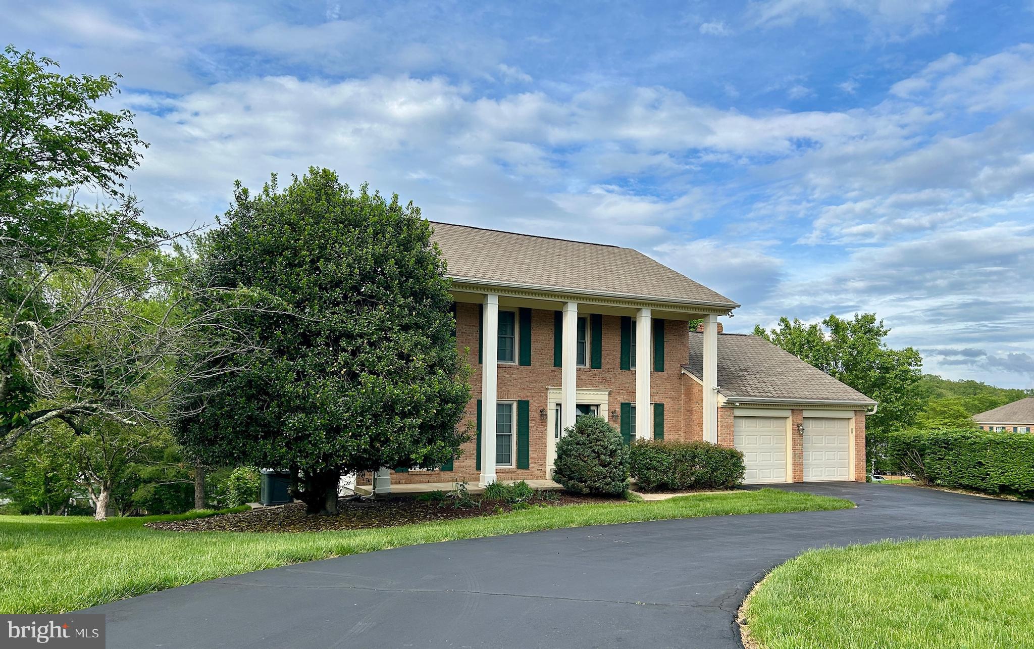 Welcome to 9844 Faust Drive, where charm meets functionality in the highly coveted Wolftrap Meadows neighborhood! This beautiful home, nestled on a picturesque corner lot with a grand circular driveway, is the perfect blend of style, comfort, and convenience. Step inside to find three thoughtfully designed levels, perfect for both everyday living and effortless entertaining. The main level welcomes you with a classic center foyer, flanked by a private home office on one side and an elegant formal living room on the other. At the heart of the home lies the recently updated dream kitchen—a true showstopper. Featuring a massive center island, a dedicated baker’s nook, and abundant prep and storage space, this kitchen caters to every culinary need. Adjacent to the kitchen, you’ll find a formal dining room for special occasions and a cozy family room with a wood-burning fireplace. Sliding glass doors lead to a low-maintenance Trex deck with enclosed storage beneath, creating the perfect indoor-outdoor flow. Upstairs, the primary suite offers a peaceful retreat with its spacious layout and ensuite bathroom. Three additional bright and airy bedrooms, paired with a full hallway bathroom, provide ample space for family and guests alike. The walkout lower level boasts a large rec room with a wet bar and a second wood-burning fireplace. Sliding doors take you out to a patio with beautiful views. This level also has a fifth bedroom, a full bathroom, and tons of storage space.
Additional highlights include its prime location within the desirable Westbriar, Kilmer, and Marshall school pyramid and its proximity to the Fairfax County Cross County Trail, which seamlessly connects to the W&OD trails for outdoor enthusiasts. This home is more than just a place to live—it's a lifestyle. Come and see for yourself!