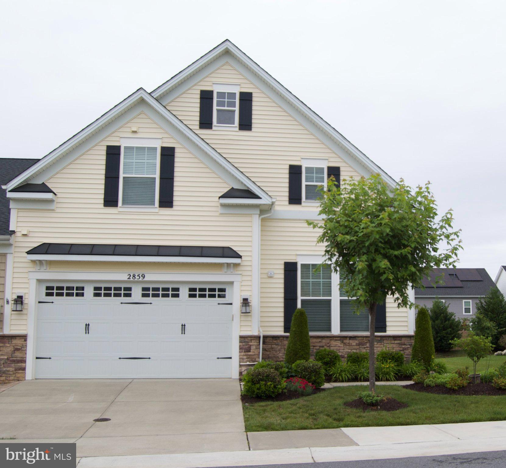 Discover the ease of upscale, low-maintenance living in the highly sought-after 55+ community of Two Rivers. Villas like this are rarely available and highly desirable for their unique appeal. Thoughtfully designed for comfort, convenience, and active adult living, this exceptional and economical end-unit villa offers beautifully finished living space perfect for those ready to enjoy life without the burden of constant upkeep.
This four-bedroom, four-bath villa was built by the highly respected Classic Group Builders and is known as one of the most sought after models, the “Vivian Model.” It features over $75K of premium upgrades, abundant natural light, and luxurious finishes throughout. The main level is designed for easy single-level living and includes a spacious primary suite with a spa-inspired bath, dual vanities, and an oversized walk-in closet. The open-concept layout creates a warm and inviting atmosphere with 9-foot ceilings, elegant living, dining spaces, and a dedicated home office for added flexibility. Additional conveniences include an interior entrance to the kitchen from the attached garage, laundry room with an energy-efficient washer, dryer and utility sink. 
The gourmet kitchen is sure to delight anyone who enjoys cooking or entertaining. Granite countertops, a large center island, stainless steel appliances, hardwood floors, and custom cabinetry provide both beauty and functionality for everyday living and special gatherings. Unwind on the paver patio with a comfortable sitting area, perfect for cookouts, casual gatherings, and getting to know the community’s welcoming neighbors.
Upstairs, guests will appreciate their own private retreat featuring a spacious bedroom, en suite bath, and a versatile loft area perfect for hobbies, reading, or additional entertaining space. The finished lower level offers a large recreation room ideal for movie nights, visiting grandchildren, hosting game-day gatherings, or accommodating a college student, along with abundant storage space. You’ll never have to worry about where to store your holiday decorations again.
Life at Two Rivers is about more than just a beautiful home—it’s a lifestyle. Residents enjoy resort-style amenities including indoor and outdoor pools, a state-of-the-art fitness center, pickleball and tennis courts, walking and biking trails, a yoga studio, and a vibrant social calendar. Best of all, lawn care and snow removal are included through the HOA, allowing you more time to travel, relax, and enjoy the things that matter most.