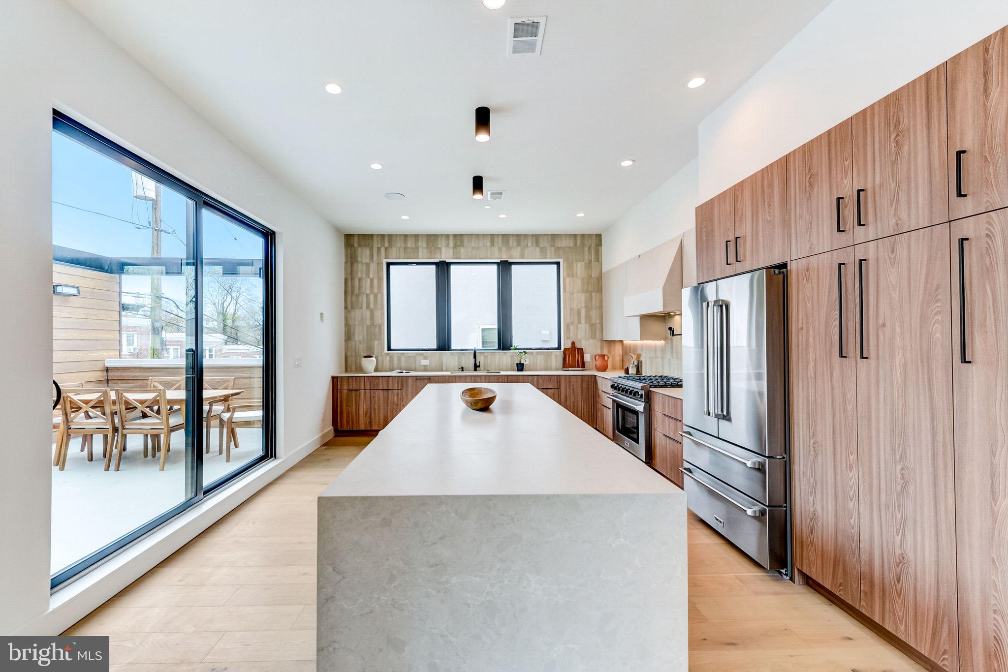 315 Delmar is a stunning new construction home by acclaimed GNOME Architecture and Design, renowned for its innovative and award-winning designs. This one-of-a-kind residence spans an impressive 28 feet in width, epitomizing modern elegance and sophisticated design.  Boasting over 3,500+ square feetq.ft.of meticulously curated living space, w/4 spacious bedrooms, 4 luxurious full baths, and 2 half baths. With a 3-car attached garage and three fantastic and fun outdoor entertaining areas, every detail of this residence has been thoughtfully designed to enhance your living experience.  Enjoy the contemporary open floor plan which seamlessly blends indoor and outdoor spaces, accentuated by an exceptional glass-to-square-foot ratio that floods the home with natural light. Super high ceilings, complemented by recessed lighting and warm wood floors, set the stage for an atmosphere of refined luxury. Each level showcases impeccable craftsmanship, w/unique arches, graceful curved walls, and designer sconces that add a touch of artistry.  This residence not only stands out for its architectural brilliance but also offers a 10-year tax abatement and a 2-year builder's warranty, ensuring both value and peace of mind. Located close to vibrant restaurants, cozy coffee shops, diverse shopping options, and scenic parks, 315 Delmar provides both tranquility and convenience.  Contact us today to schedule your private tour of this must-see home,