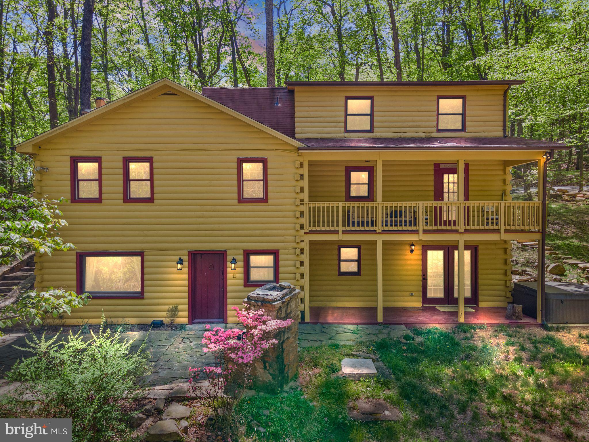 Unique property with a beautiful 4 bedroom, 3 bath log cabin home and 3 acres of total privacy. Mountain living at its finest yet only minutes away from Haymarket & I66 and less than an hour to DC. 2 car oversized 2 level garage with shop and loft. Spacious fluid living area with a fully equipped kitchen, two master bedrooms with jet tubs plus two more bedrooms and den (5th bedroom), sitting/family room, separate laundry room with a sink, plenty of closets. Cathedral ceiling, gorgeous wood around the house, stain-glass windows. Fios WiFi. Brand new 8 person outdoor hot tub, fire pit, covered porch, stone patios, large deck overlooking lawn, pond, stream and cute natural waterfall - this home is a true wooded mountain resort. Battlefield HS pyramid. Tons of space for parking and storage. Two hundred foot asphalt driveway. Handicap accessible. No HOA. Serene, pristine, quiet and secure - live in paradise right now! A truly one of a kind and special property. Come view and fall in love! To qualify please have an income of $100K or more and at least a 650 credit score.