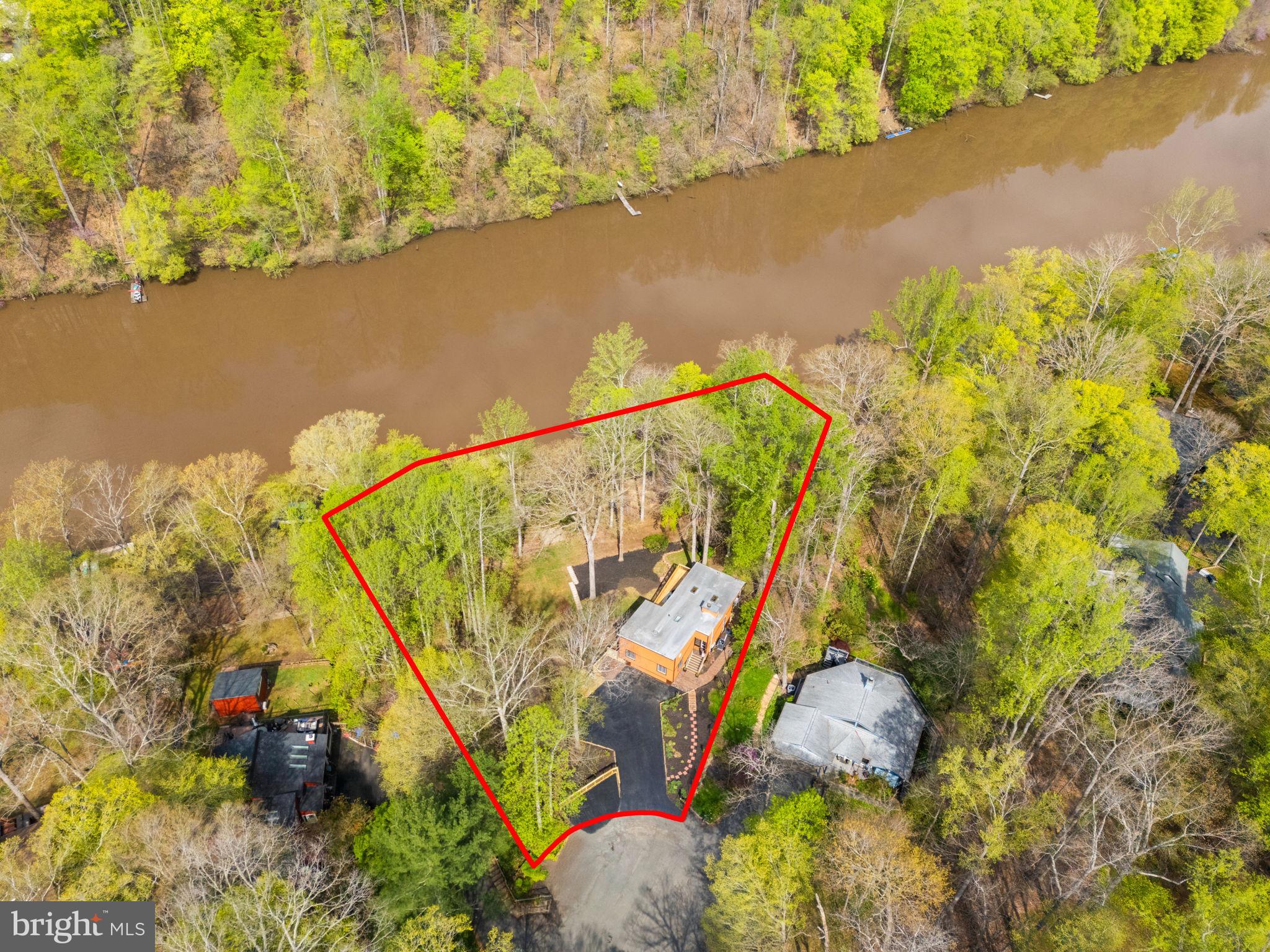 Stunning Contemporary Waterfront Home in Occoquan Forest

📍 360' of Water Frontage | Private Dock | Fully Renovated | Just Under 1 Acre

Welcome to one of the most extraordinary properties in the coveted Occoquan Forest community—a fully renovated contemporary home nestled on nearly an acre of prime waterfront, offering an unmatched 360 feet of water frontage.

With 4 spacious bedrooms, 3.5 beautifully updated bathrooms, and approximately 2,900 square feet of refined living space, this home blends modern comfort with serene, natural surroundings.

Highlights include:

Private dock with 3 boat slips and a double sun deck right at the water’s edge—ideal for boating, fishing, or simply soaking in the tranquility.
Expansive multi-level decking and extensive landscaping provide the perfect backdrop for outdoor entertaining or quiet mornings watching the sunrise over the water.
The owner's suite features a private patio with breathtaking river views—your personal retreat in nature.
Open-concept living spaces with large windows and multiple skylights  invite natural light and panoramic views from nearly every room.
Regular visits from bald eagles, migratory waterfowl, and other wildlife make every day feel like a nature getaway.
This rare property combines the peace of a forest retreat with the perks of waterfront living. Whether you're kayaking before breakfast or unwinding with a glass of wine on your deck, life here feels like a permanent escape.

Little tid bits about Occoquan Forest and location: Pontoon boat recreation and grilling, fishing and other paddle sports are all permitted on the reservoir, upriver to Paradise Springs winery and downstream to Fountain Head Park and the dam at the town of Occoquan. Occoquan Forest is a serene community on a forested peninsula surrounded by the Fountainhead reservoir. The left side of the peninsula and cross streets hosts several hundred homes and the right side at the water is set aside for voluntary HOA access to community walking trails and a private picnic area, playground and dog park. Outdoor activities abound, including hiking through several miles of neighborhood trails-with a convenient trailhead only 50ft from the property and connecting to the riverfront trail, community park and every side street. More extensive hiking is available at the trail head near Bull Run Marina, 10 min from the house. Fishermen love the reservoir, and there are both crew teams and beginner classes that depart from the nearby marine and sometimes pass the house. With a welcoming community it's easy to come to the "Forest" but hard to leave. In other words, this home is one you won't want to miss!
