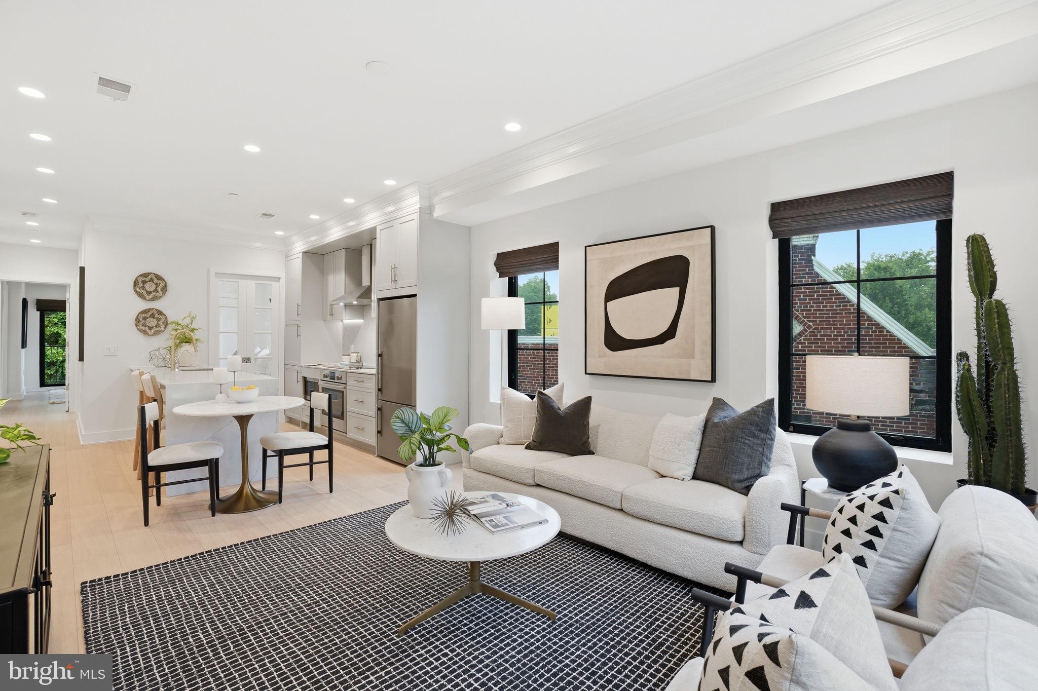 Bright and beautifully updated 2-bedroom, 2-bath condo in sought-after Glover Park. This stunning residence showcases wide-plank European white oak engineered hardwood flooring, soaring ceilings, and a thoughtfully designed open-concept layout ideal for modern living. The chef’s kitchen features sleek Stuart cabinetry, Carrara Venatino quartz countertops, premium appliances, designer hardware, and a striking island perfect for dining and entertaining.

The spacious primary suite opens to a private balcony—an ideal retreat for morning coffee or evening relaxation. Additional highlights include recessed lighting, stylish architectural accents, noise-reducing windows, and upscale finishes throughout.

Built just four years ago, this boutique building offers contemporary design and quality craftsmanship. Ideally located moments from Whole Foods, neighborhood dining, parks, and public transportation, this home delivers the perfect blend of luxury, comfort, and convenience in one of DC’s most desirable neighborhoods. Low condo fee!