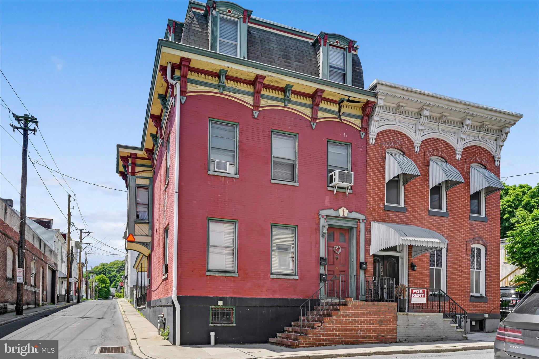 Turnkey 3-unit investment opportunity in Downtown Pottsville. This charming red brick corner property features historic 1900s architectural details that gives the building a strong curb appeal. The property includes three 2-bedroom units, all currently leased to provide immediate and consistent cash flow. Each unit offers a functional layout with a kitchen and full bathroom. Gas heat with separate zones is already in place to maintain low operating costs. Conveniently located within walking distance of the courthouse and the downtown business district, the property is close to businesses, shops, restaurants, and everyday amenities that support steady rental demand. With its classic character and convenient location, this is a straightforward, income-producing property with a proven rental history and long-term upside. POF or preapproval required to schedule a showing.