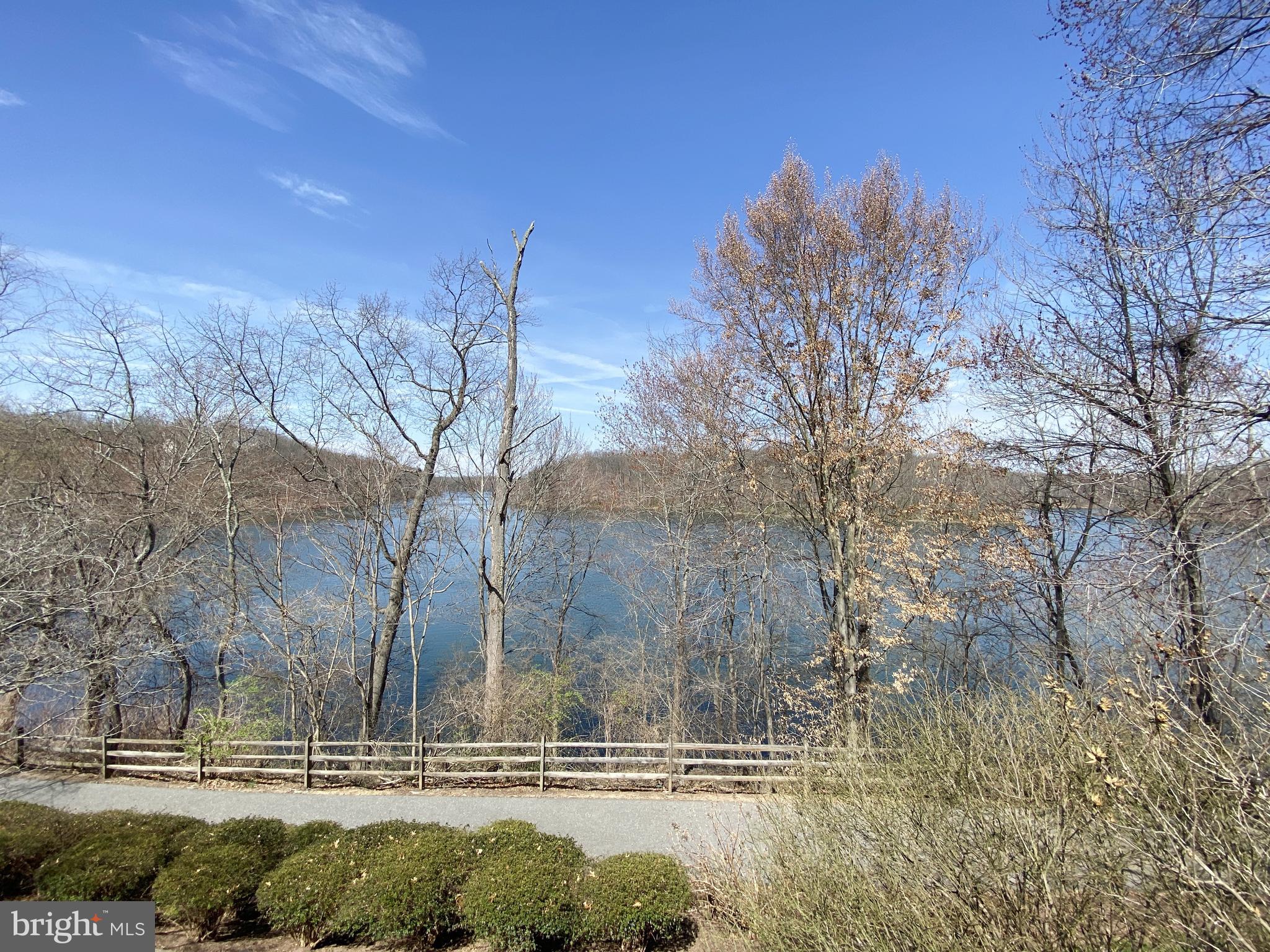 Incredible Lake Views! !!This rarely available townhome, backing to the lake, offers 3 bedrooms, 3 full bathrooms, and 1 half bathroom. Numerous upgrades include an updated eat-in kitchen with a charming box window, hardwood floors in the living and dining rooms, and a slider leading to an oversized deck with breathtaking views. The fully finished lower level walks out to a second deck and a private rear yard. The home is flooded with natural light!