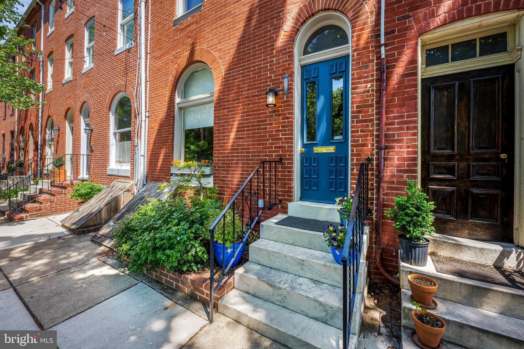 Now at a newly repositioned price, this handsome Federal Hill townhome combines classic charm, generous living space, and an exceptional location.  Open Saturday May 30 from 12:00-1:30 and Sunday May 31 from 1:00 - 2:30
Main Level: Enter through the vestibule into a spacious living room featuring elegant hardwood floors, a cozy fireplace, and a charming library nook. The main level also includes a coat closet, a convenient powder room, a formal dining room, and a well-appointed eat-in kitchen with a breakfast nook. Just beyond the kitchen, the private patio offers an ideal setting for relaxing, grilling, or entertaining.
Second Floor: The second level features a comfortable primary suite with an ensuite bath, along with a generously sized family room, an additional bedroom, and another full bathroom—providing flexible space for everyday living and guests.
Third Floor and Rooftop: Upstairs, you’ll find two more bedrooms, another full bathroom, and a bonus area that works well as a playroom, TV lounge, or exercise space. One level higher, the expansive rooftop deck offers sweeping city views and a perfect vantage point for Fourth of July fireworks.
Lower Level and Neighborhood Highlights
The basement provides excellent storage and additional flexible space, ideal for hobbies or crafts.
• Just steps from Federal Hill Park
• Close to Light Street shops and restaurants, Cross Street Market, M&T Bank Stadium, and Camden Yards
• Includes passes to the Otterbein swimming pool, a rare and highly sought-after benefit
This is a rare opportunity to enjoy spacious city living in one of Baltimore’s most desirable neighborhoods.
